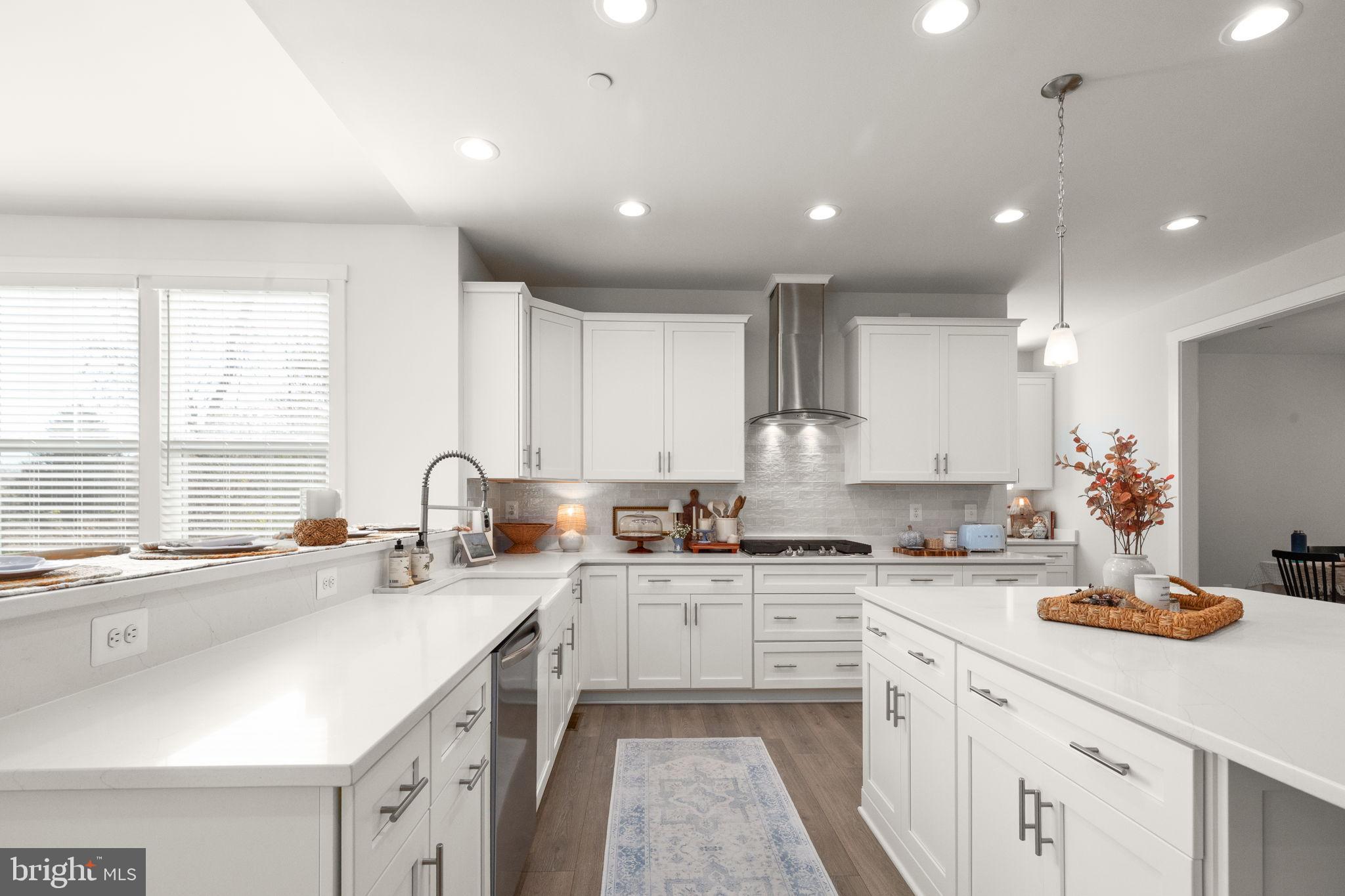424 Osage Road Cockeysville, MD 21030 - Photo 11 of 52 a kitchen with a sink stove cabinets and counter space
