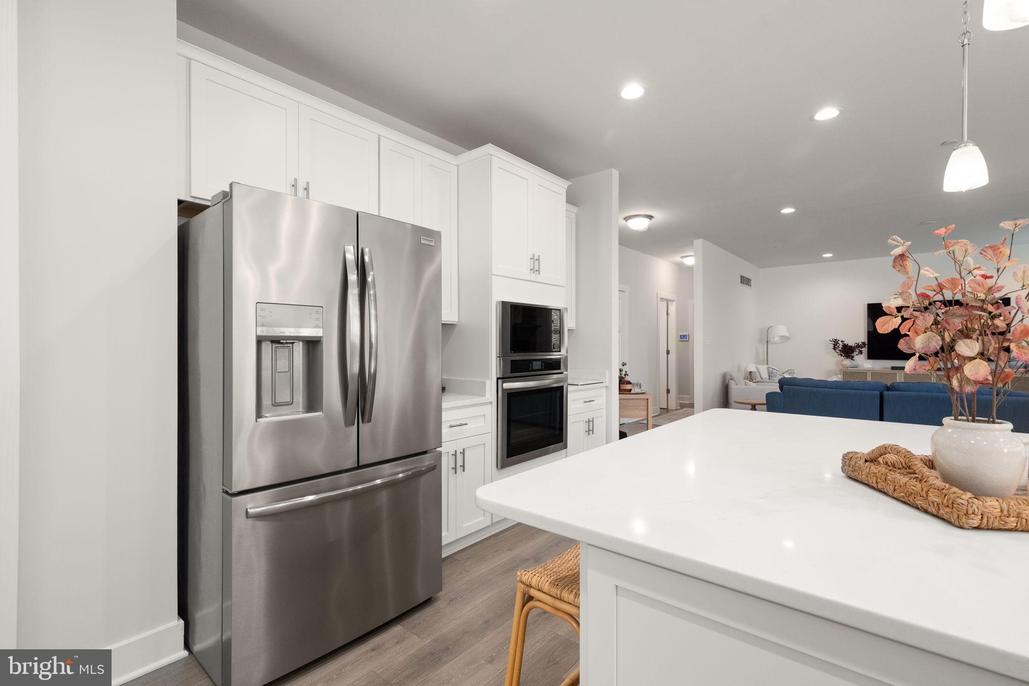 424 Osage Road Cockeysville, MD 21030 - Photo 12 of 52 a kitchen with stainless steel appliances a refrigerator sink and microwave