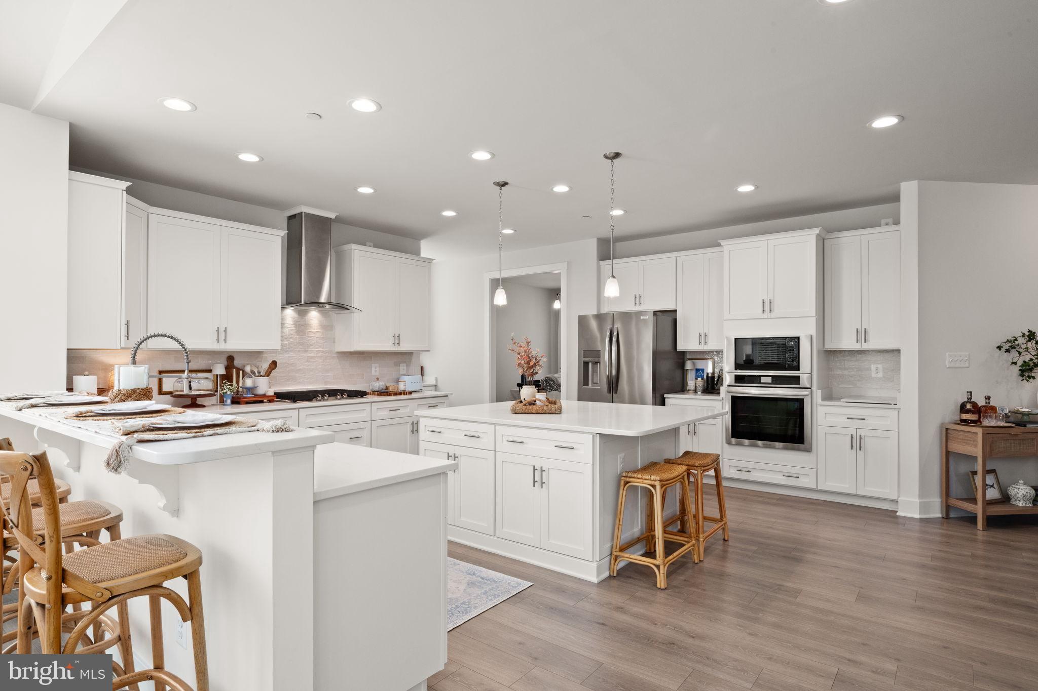 424 Osage Road Cockeysville, MD 21030 - Photo 14 of 52 a kitchen with a sink stainless steel appliances and white cabinets