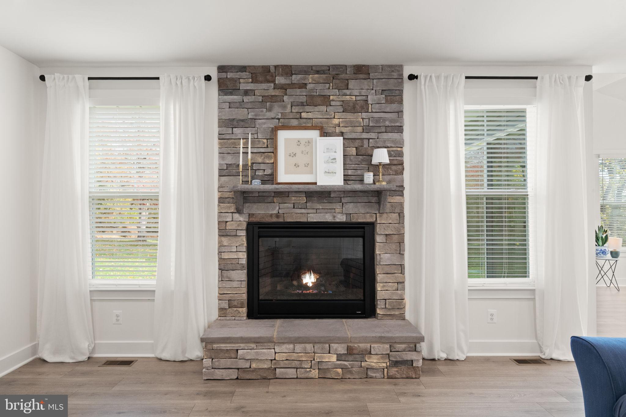 424 Osage Road Cockeysville, MD 21030 - Photo 20 of 52 a living room with a fireplace and a table