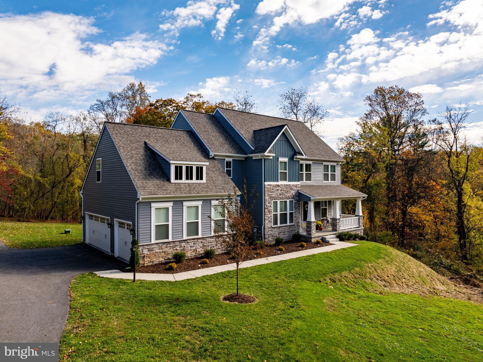 424 Osage Road Cockeysville, MD 21030 - Photo 2 of 52 a front view of a house with a yard table and chairs