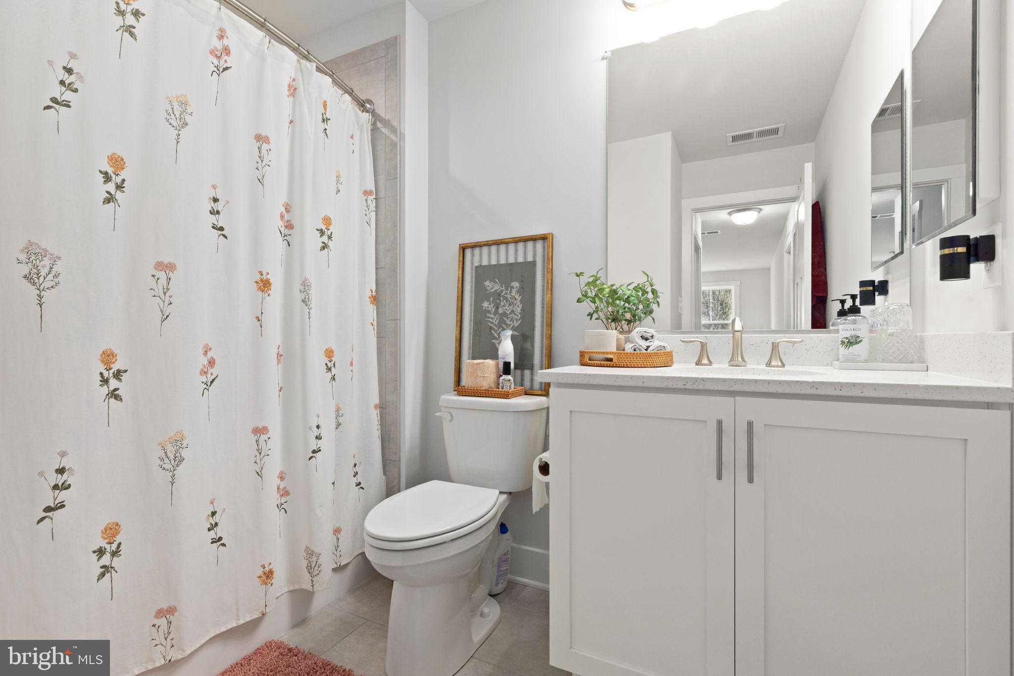 424 Osage Road Cockeysville, MD 21030 - Photo 38 of 52 a bathroom with a sink a toilet and a mirror