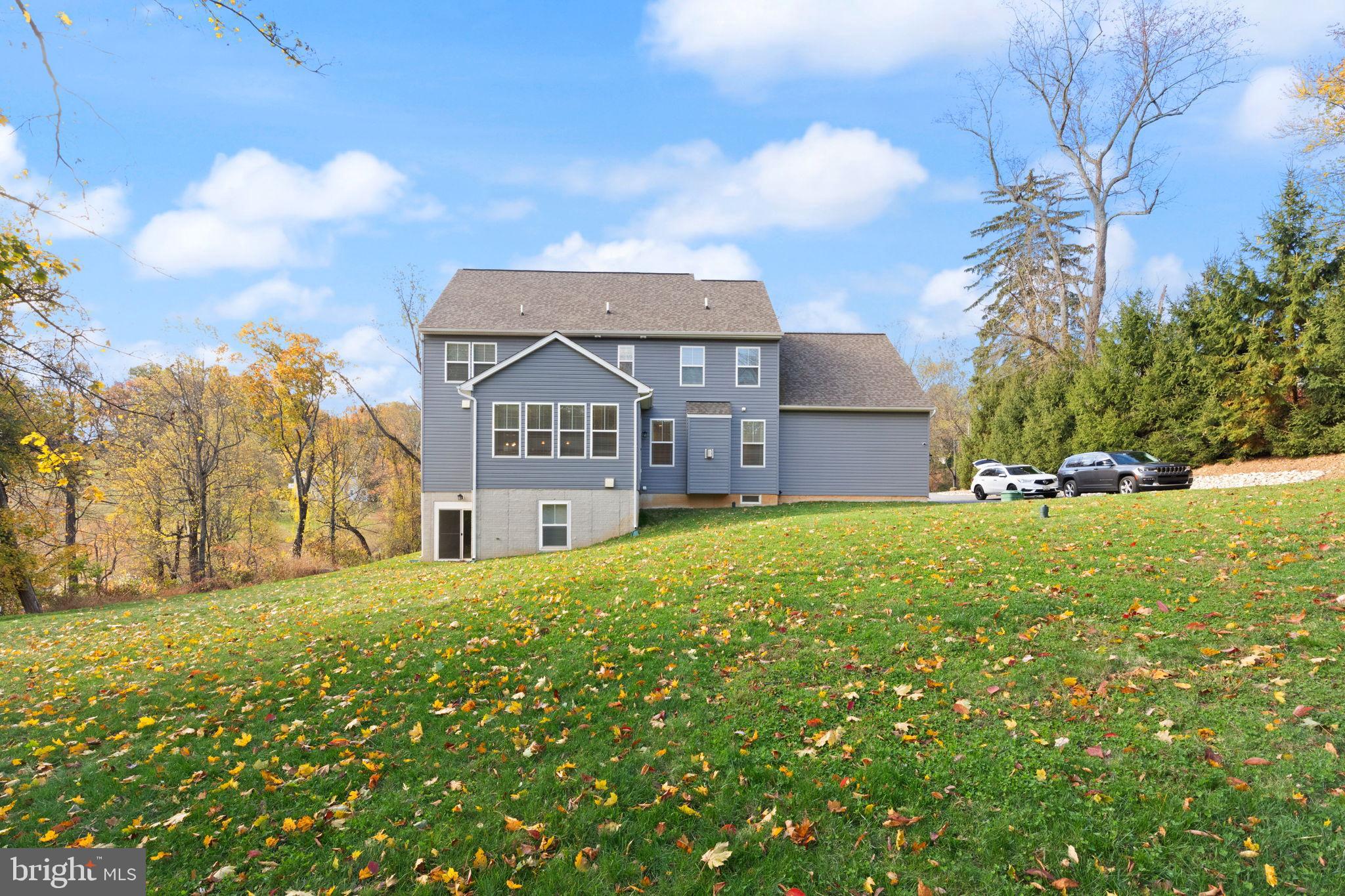 424 Osage Road Cockeysville, MD 21030 - Photo 47 of 52 a front view of a house with a yard