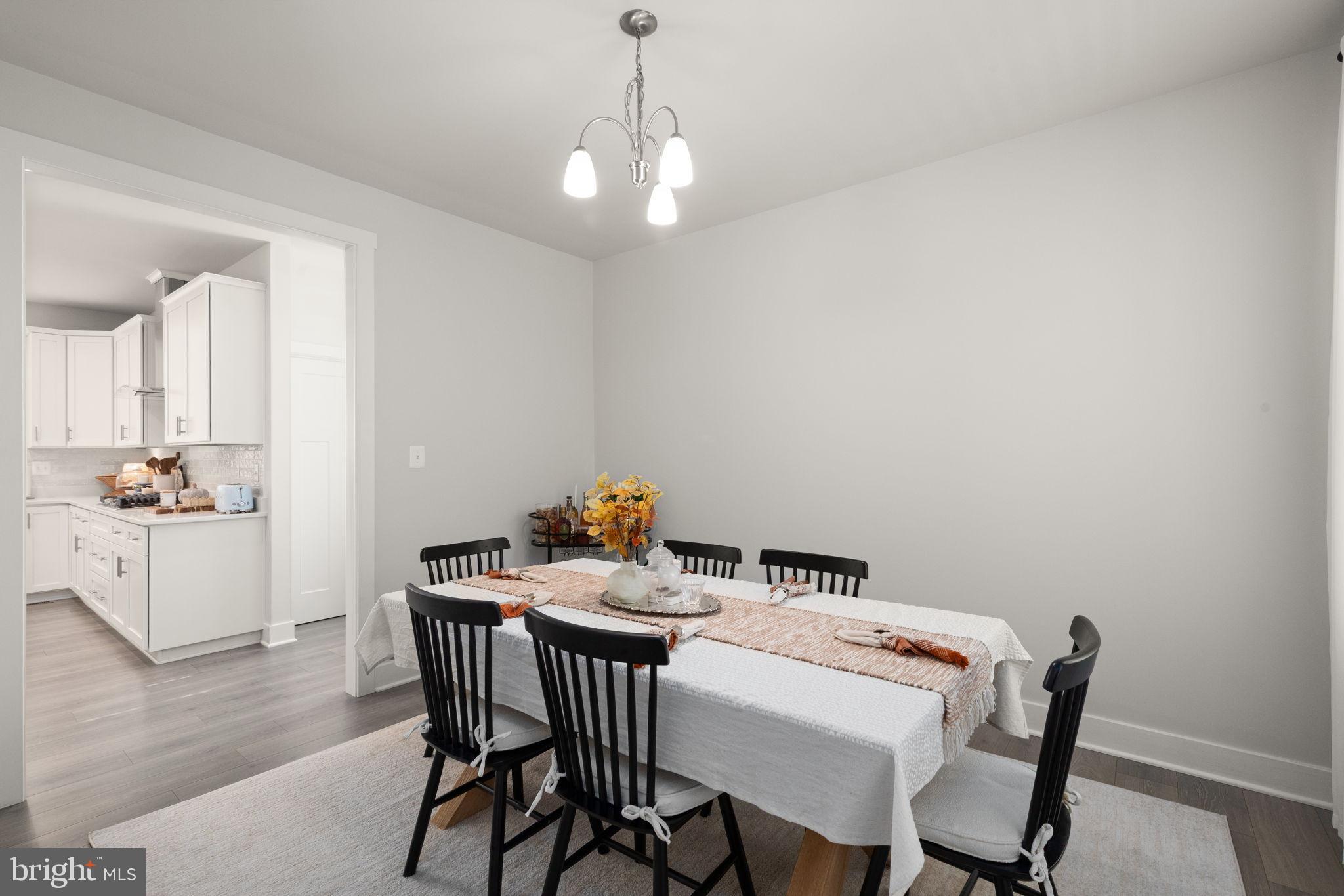 424 Osage Road Cockeysville, MD 21030 - Photo 6 of 52 a view of a dining room with furniture and wooden floor