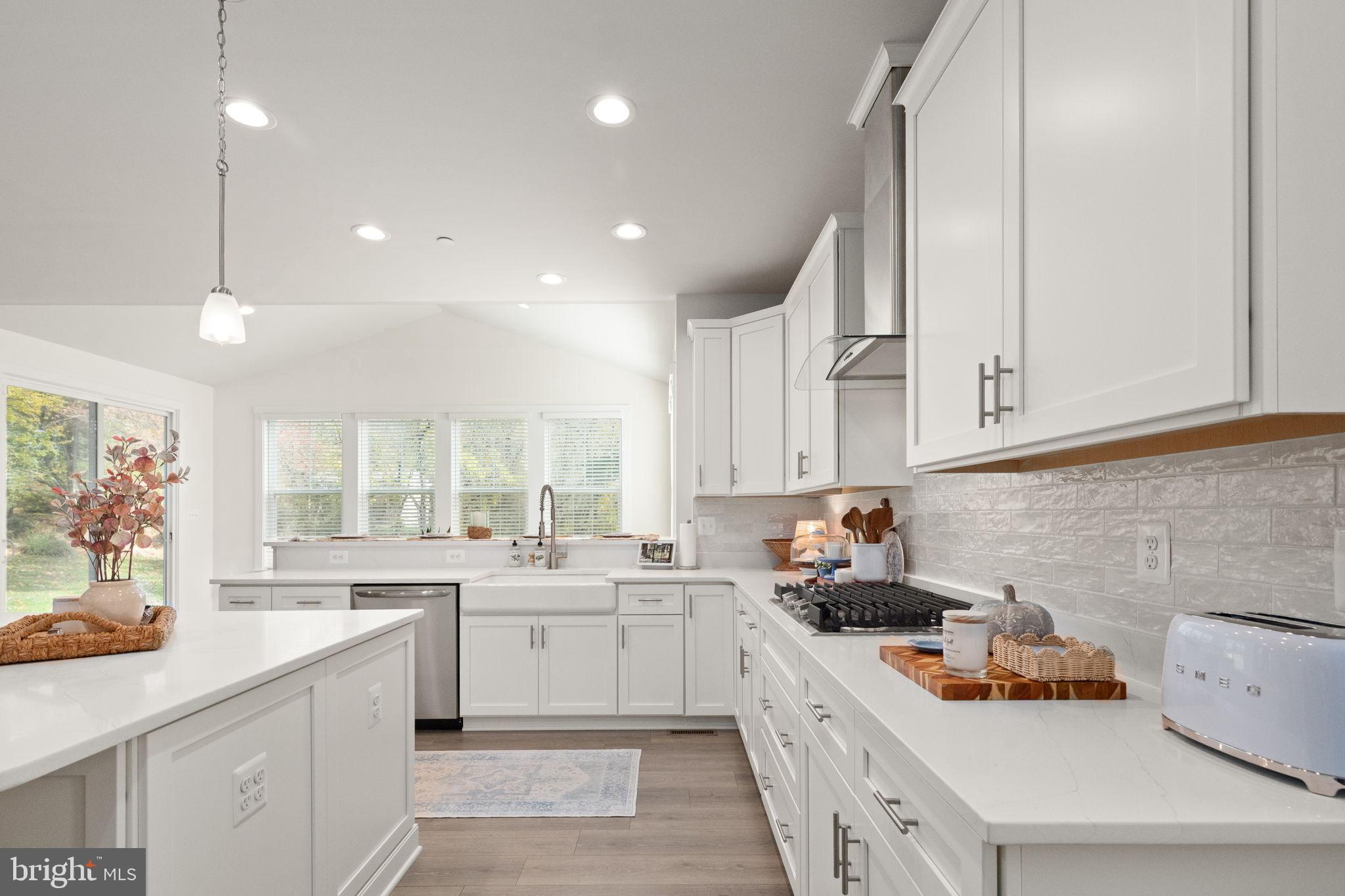 424 Osage Road Cockeysville, MD 21030 - Photo 10 of 52 a kitchen with a sink window and cabinets