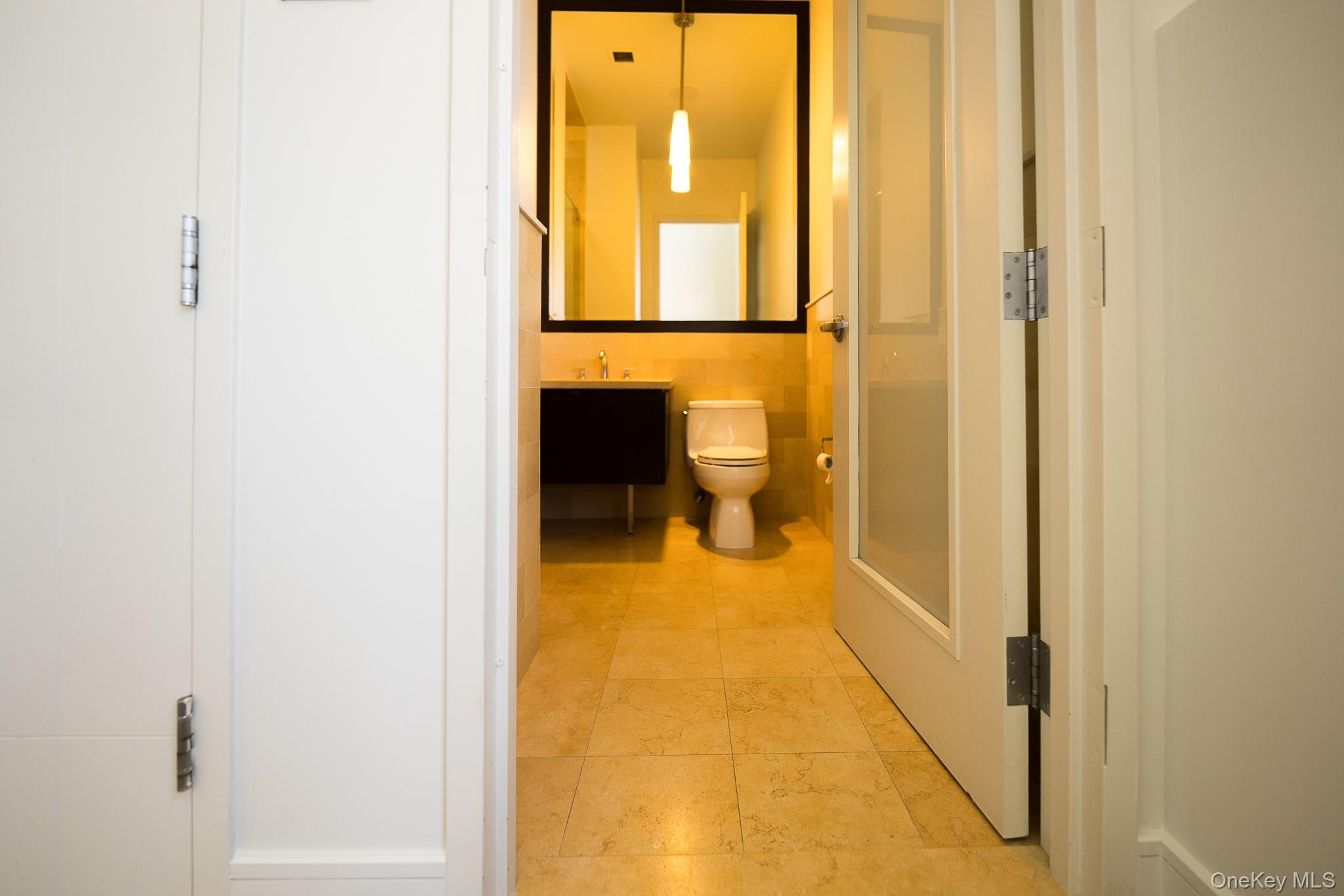 25 Leroy Place, Unit PH1 New Rochelle, NY 10805 - Photo 11 of 14 a en suite bathroom with a toilet