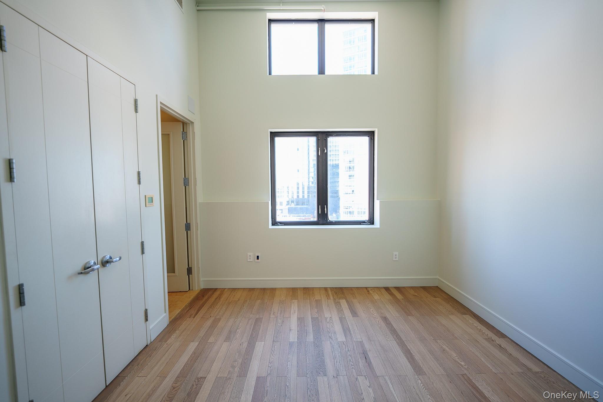 25 Leroy Place, Unit PH1 New Rochelle, NY 10805 - Photo 9 of 14 a view of a room with wooden floor and window