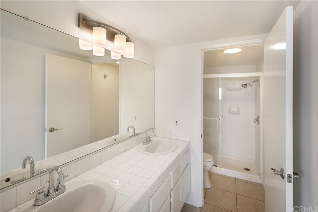 34004 Selva Road, Unit 377 Dana Point, CA 92629 - Photo 11 of 19 a bathroom with a sink a toilet and shower