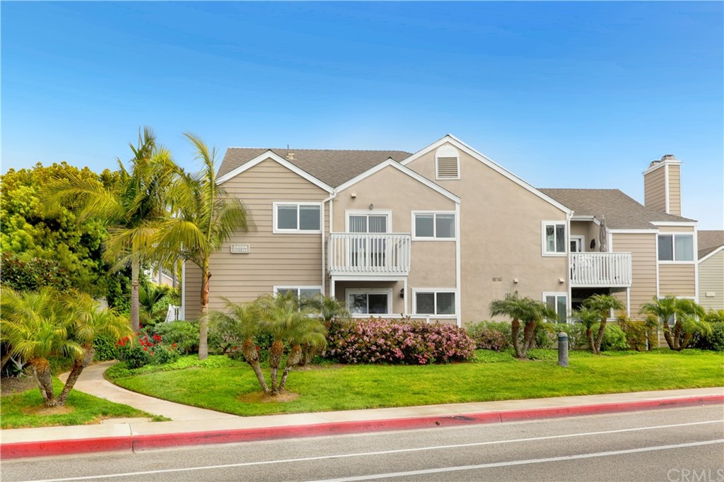 34004 Selva Road, Unit 377 Dana Point, CA 92629 - Photo 18 of 19 a front view of a house with a yard