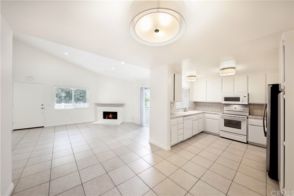 34004 Selva Road, Unit 377 Dana Point, CA 92629 - Photo 4 of 19 a kitchen with a white cabinets and white appliances
