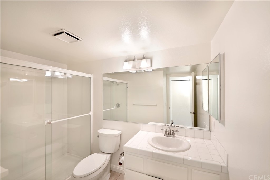 34004 Selva Road, Unit 377 Dana Point, CA 92629 - Photo 9 of 19 a bathroom with a sink a toilet and shower