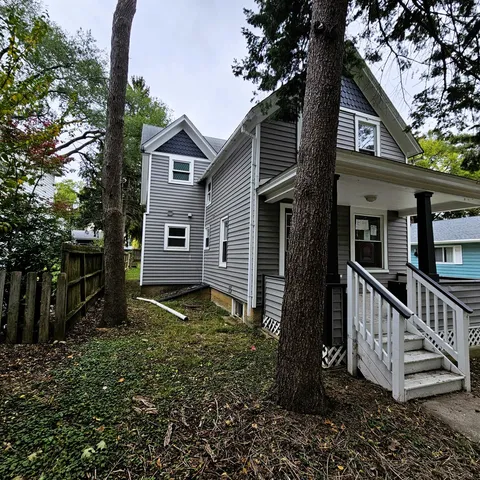 a backyard of a house with lots of green space