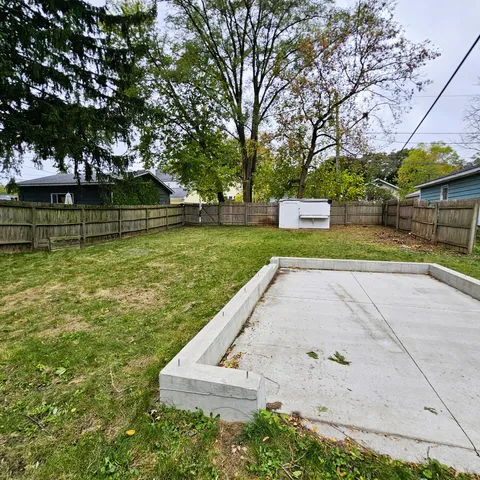 a view of a backyard with green space