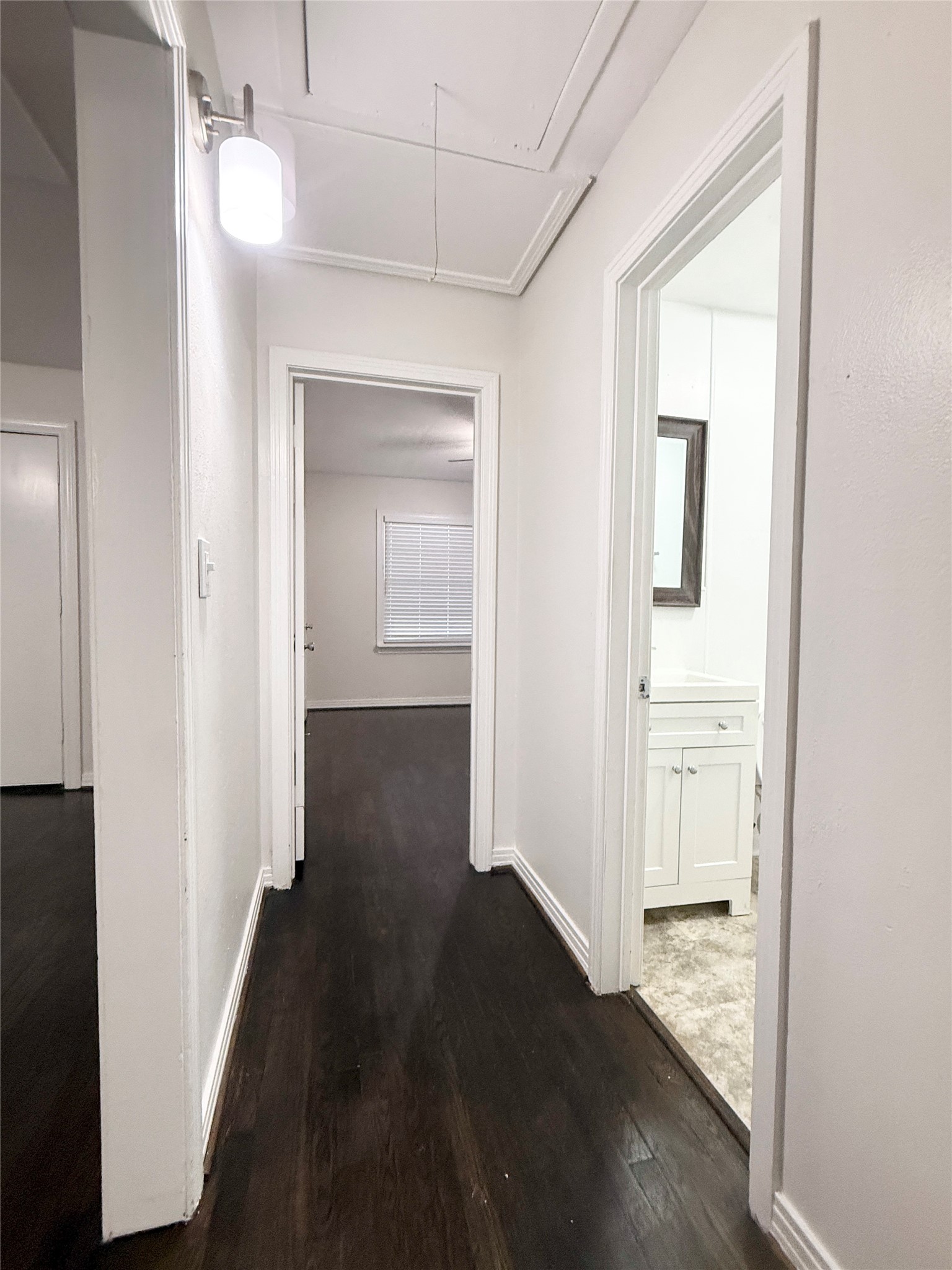 832 South Anderson Street Angleton, TX 77515 - Photo 14 of 19 a view of a hallway with wooden floor