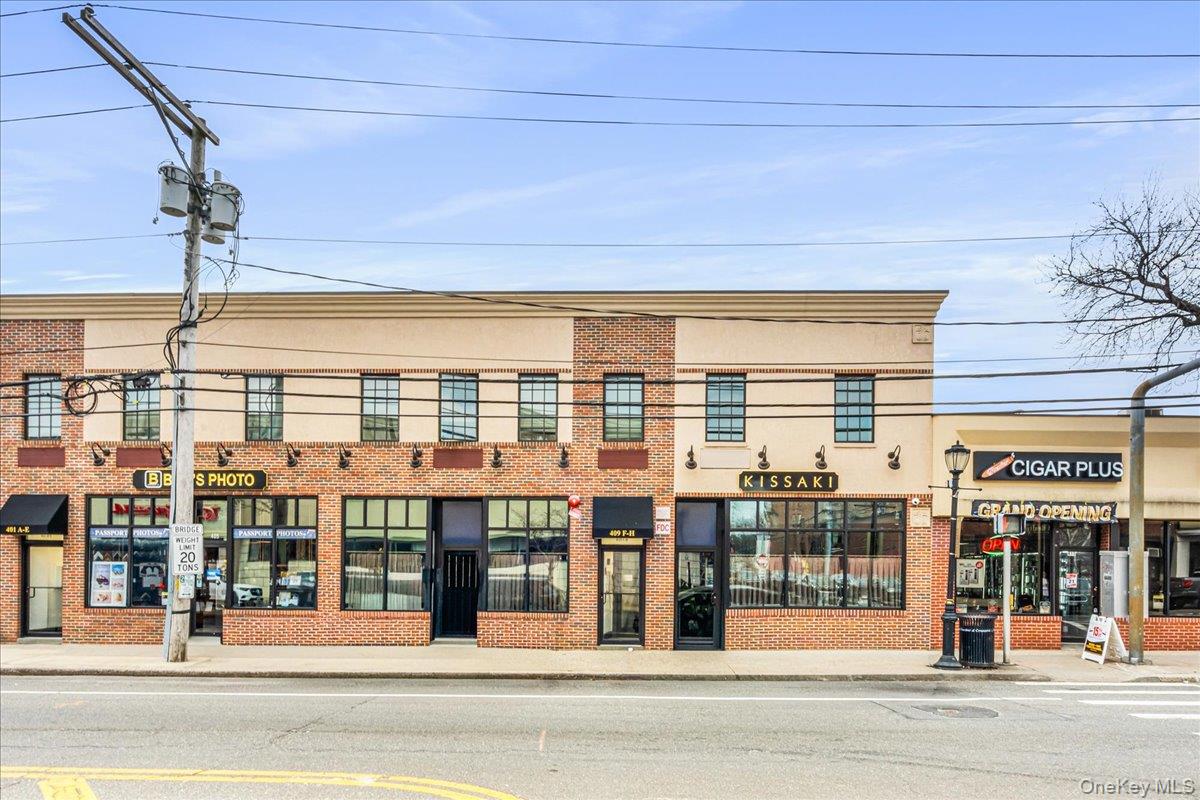 409 Plandome Road, Unit H Manhasset, NY 11030 - Photo 15 of 15 a view of a building and a street