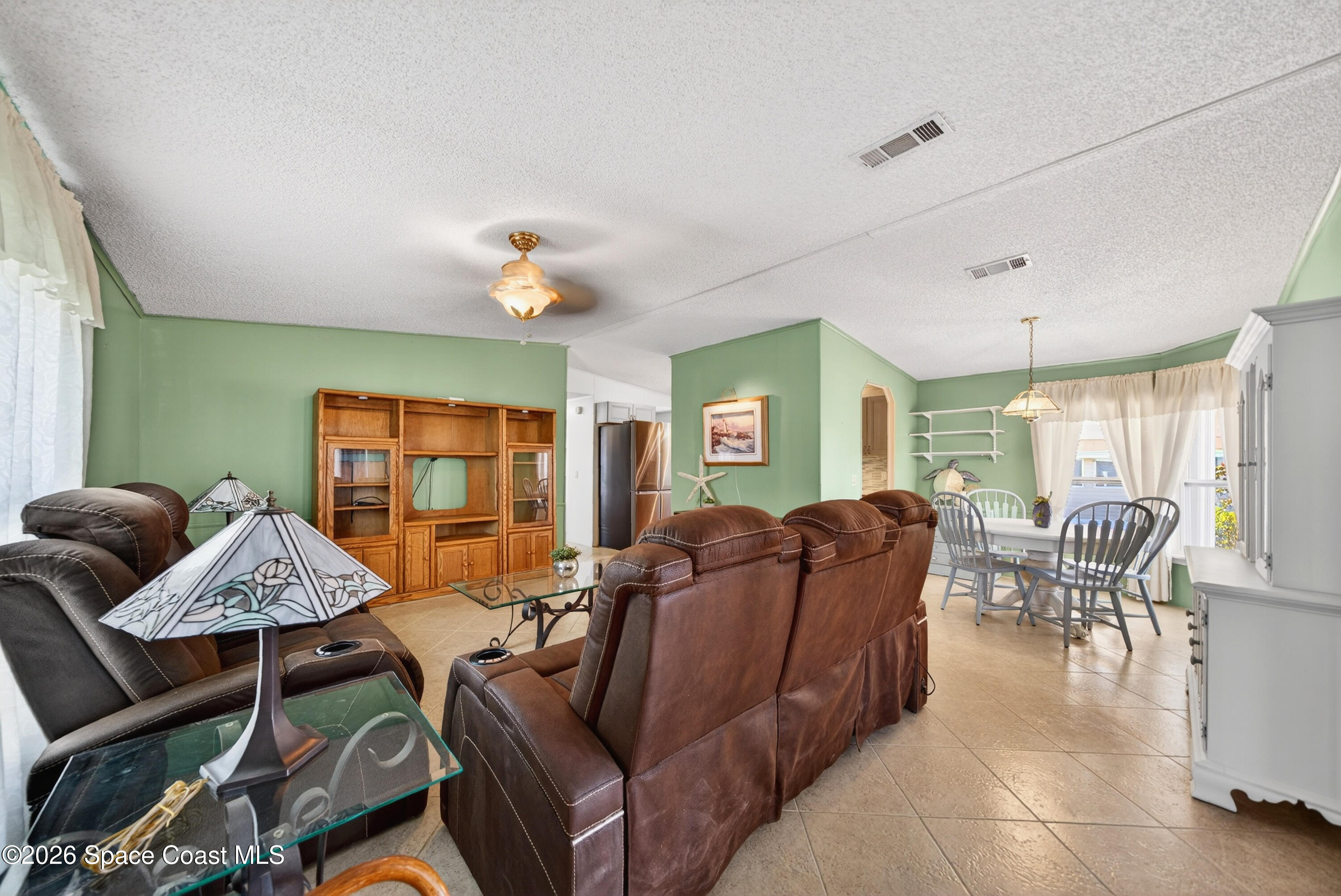 7645 Chasta Road Micco, FL 32976 - Photo 13 of 39 a living room with furniture and wooden floor