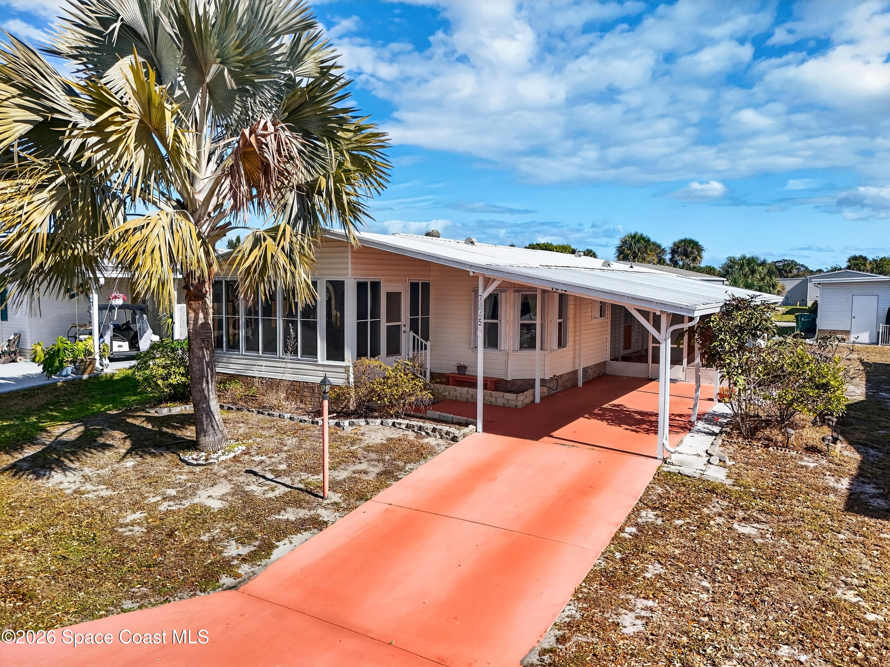7645 Chasta Road Micco, FL 32976 - Photo 2 of 39 a view of a house with a patio