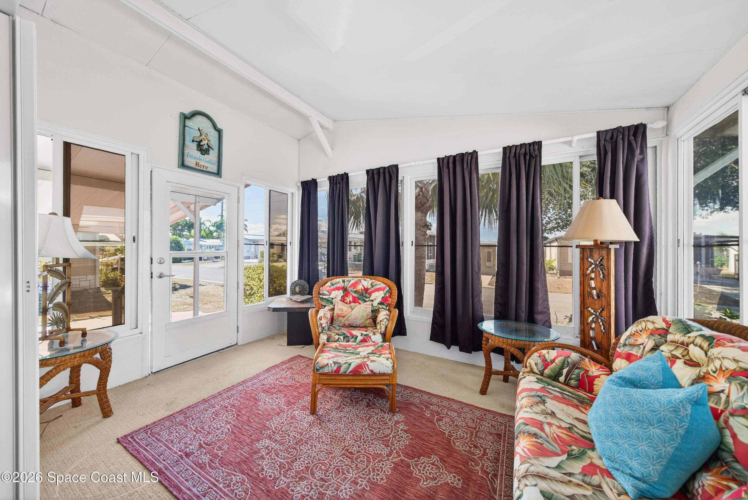 7645 Chasta Road Micco, FL 32976 - Photo 22 of 39 a living room with furniture and a window