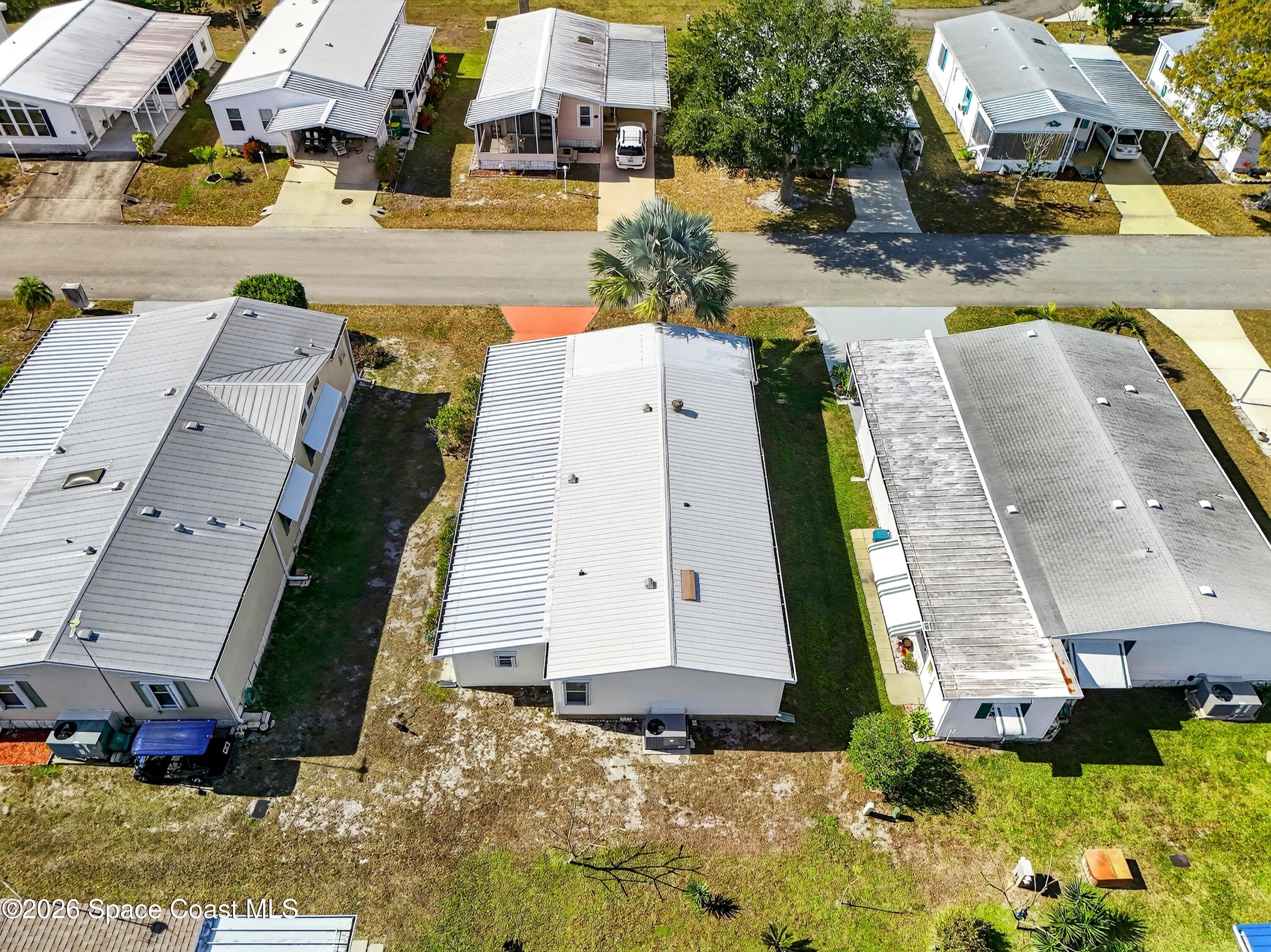 7645 Chasta Road Micco, FL 32976 - Photo 27 of 39 an aerial view of residential houses with outdoor space