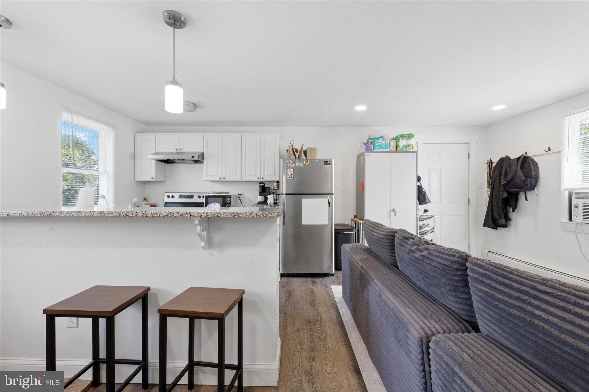 1411 Zebley Road Garnet Valley, PA 19060 - Photo 27 of 35 Modern kitchen with cozy living space.