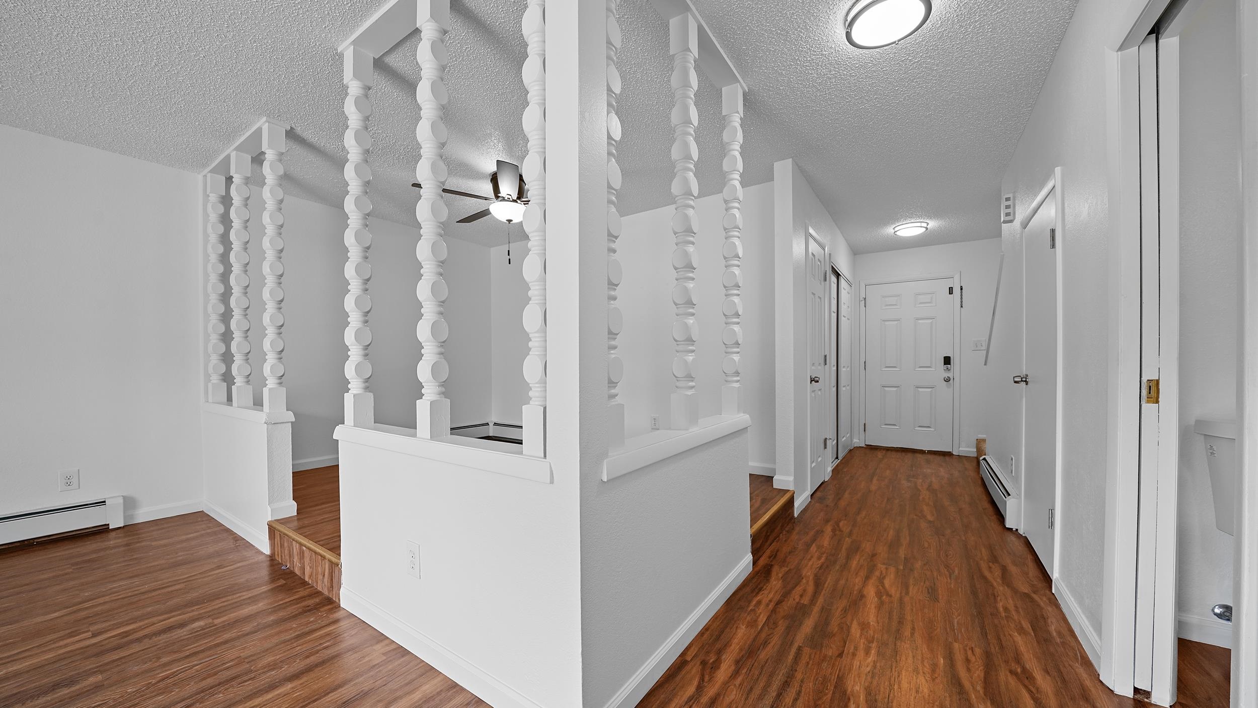 2721 Patterson Road, Unit 903 Grand Junction, CO 81506 - Photo 11 of 22 a view of a hallway with wooden floor and staircase