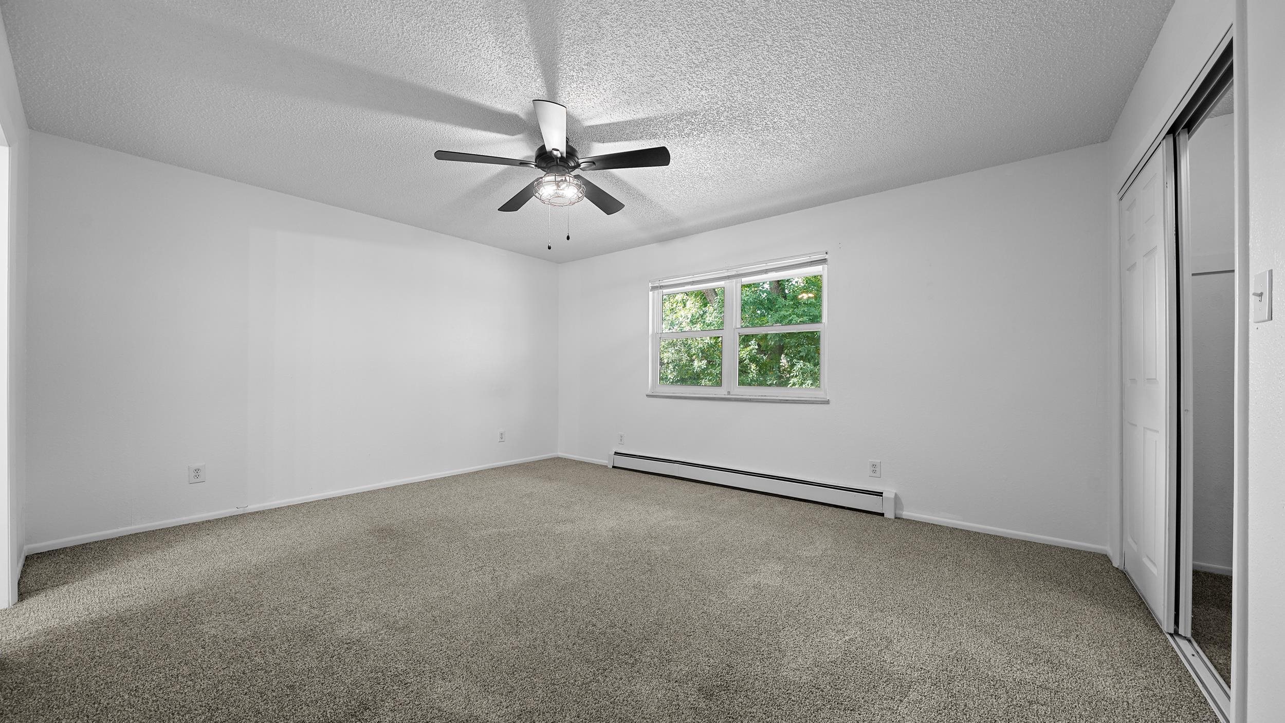 2721 Patterson Road, Unit 903 Grand Junction, CO 81506 - Photo 15 of 22 an empty room with a window and a ceiling fan