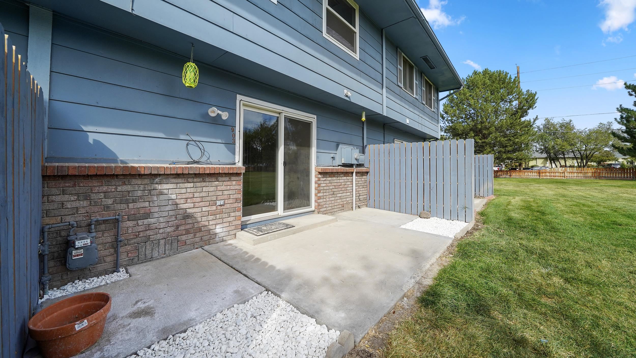 2721 Patterson Road, Unit 903 Grand Junction, CO 81506 - Photo 21 of 22 a front view of a house with a yard