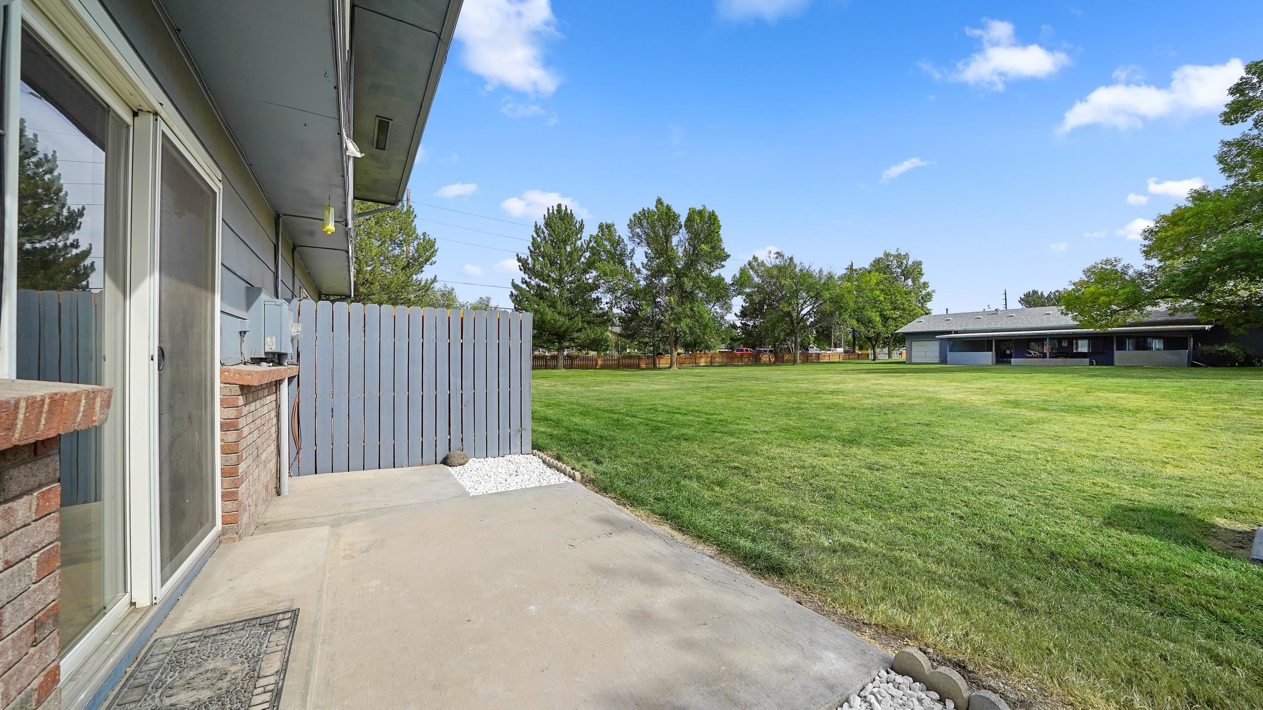 2721 Patterson Road, Unit 903 Grand Junction, CO 81506 - Photo 22 of 22 a view of a house with backyard and a patio