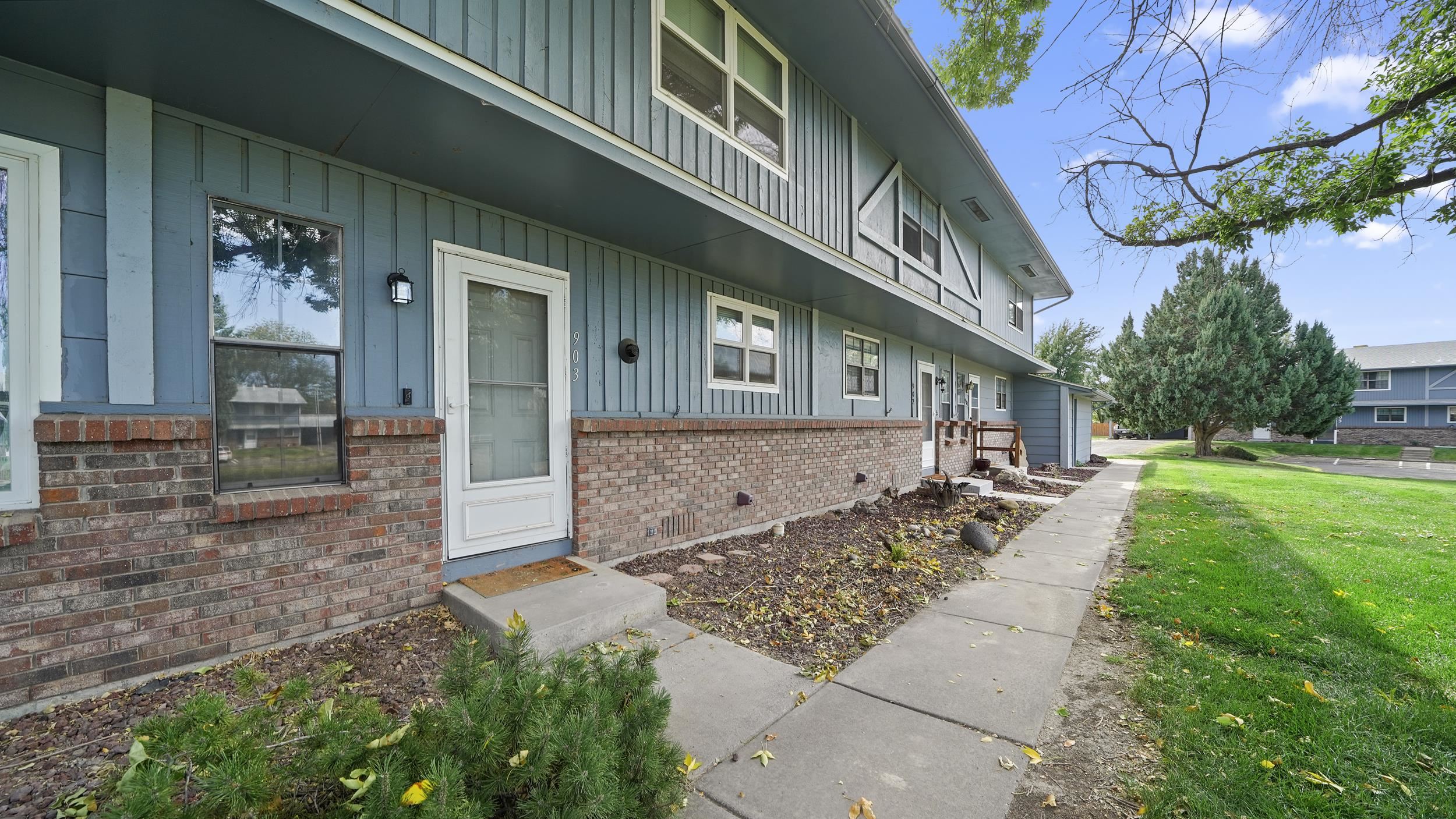 2721 Patterson Road, Unit 903 Grand Junction, CO 81506 - Photo 3 of 22 a front view of a house with a yard