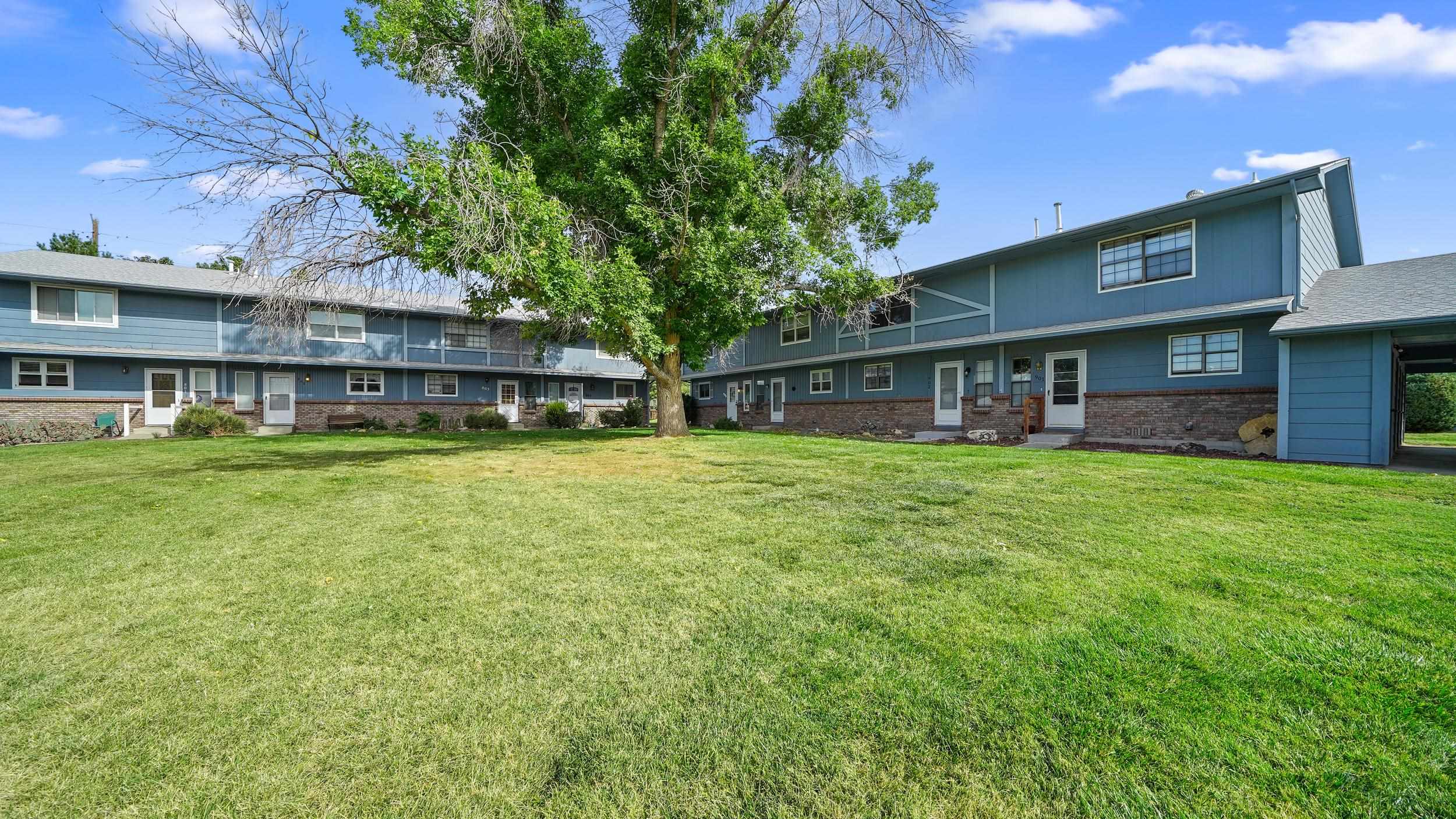 2721 Patterson Road, Unit 903 Grand Junction, CO 81506 - Photo 4 of 22 a view of a house with a big yard and sitting area