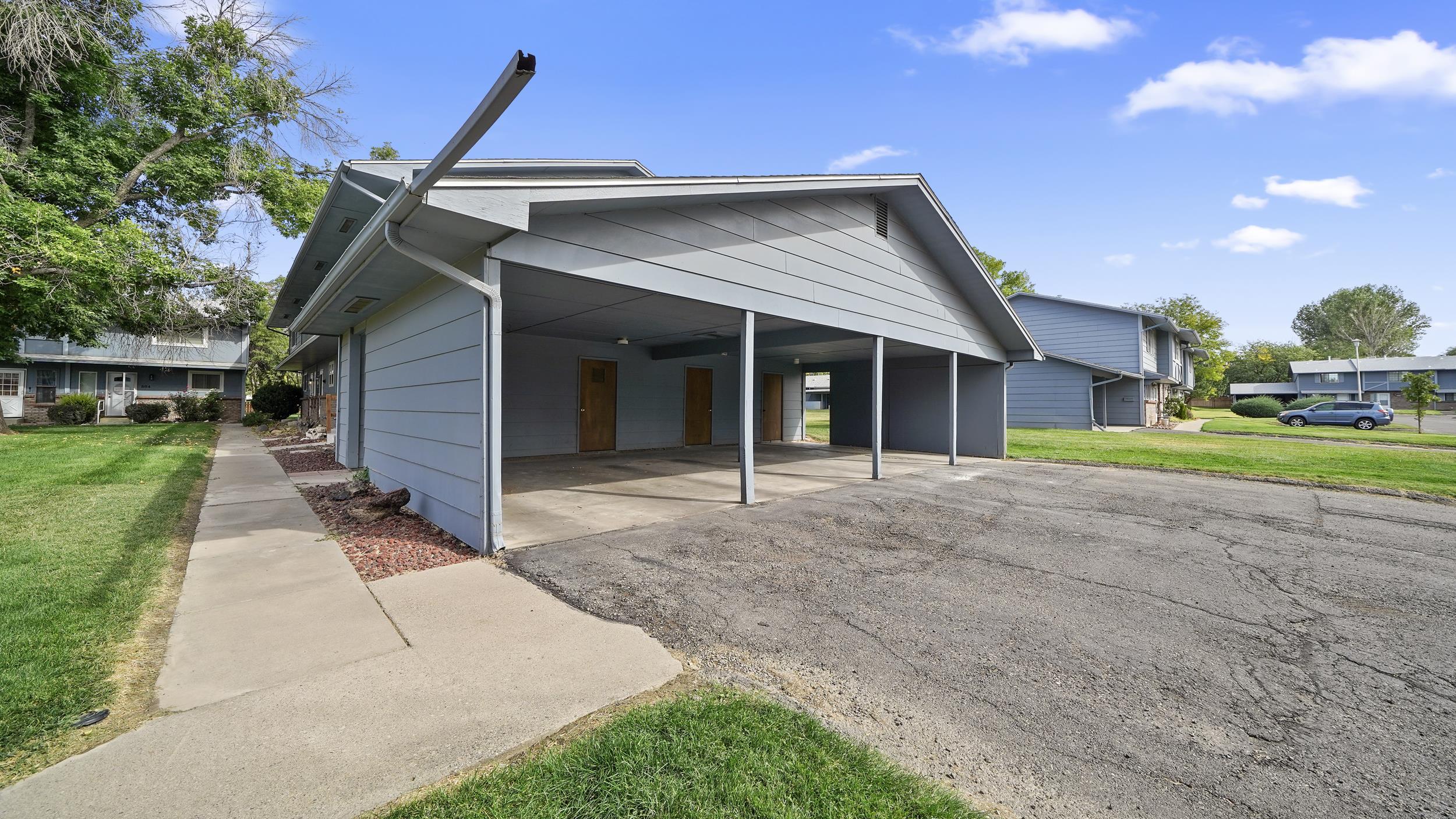 2721 Patterson Road, Unit 903 Grand Junction, CO 81506 - Photo 5 of 22 a front view of a house with a yard and garage