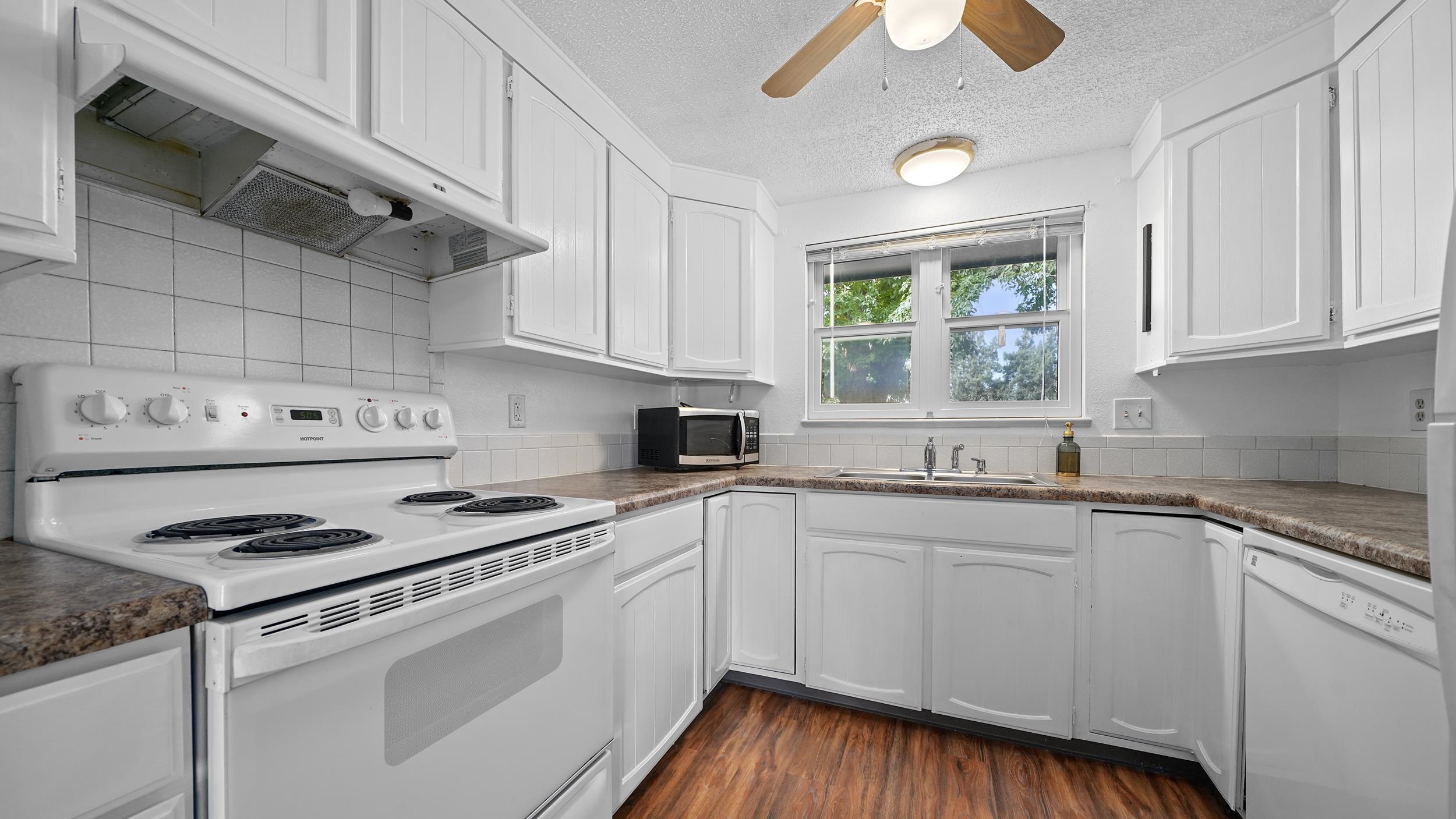 2721 Patterson Road, Unit 903 Grand Junction, CO 81506 - Photo 7 of 22 a kitchen with cabinets appliances a sink and a window