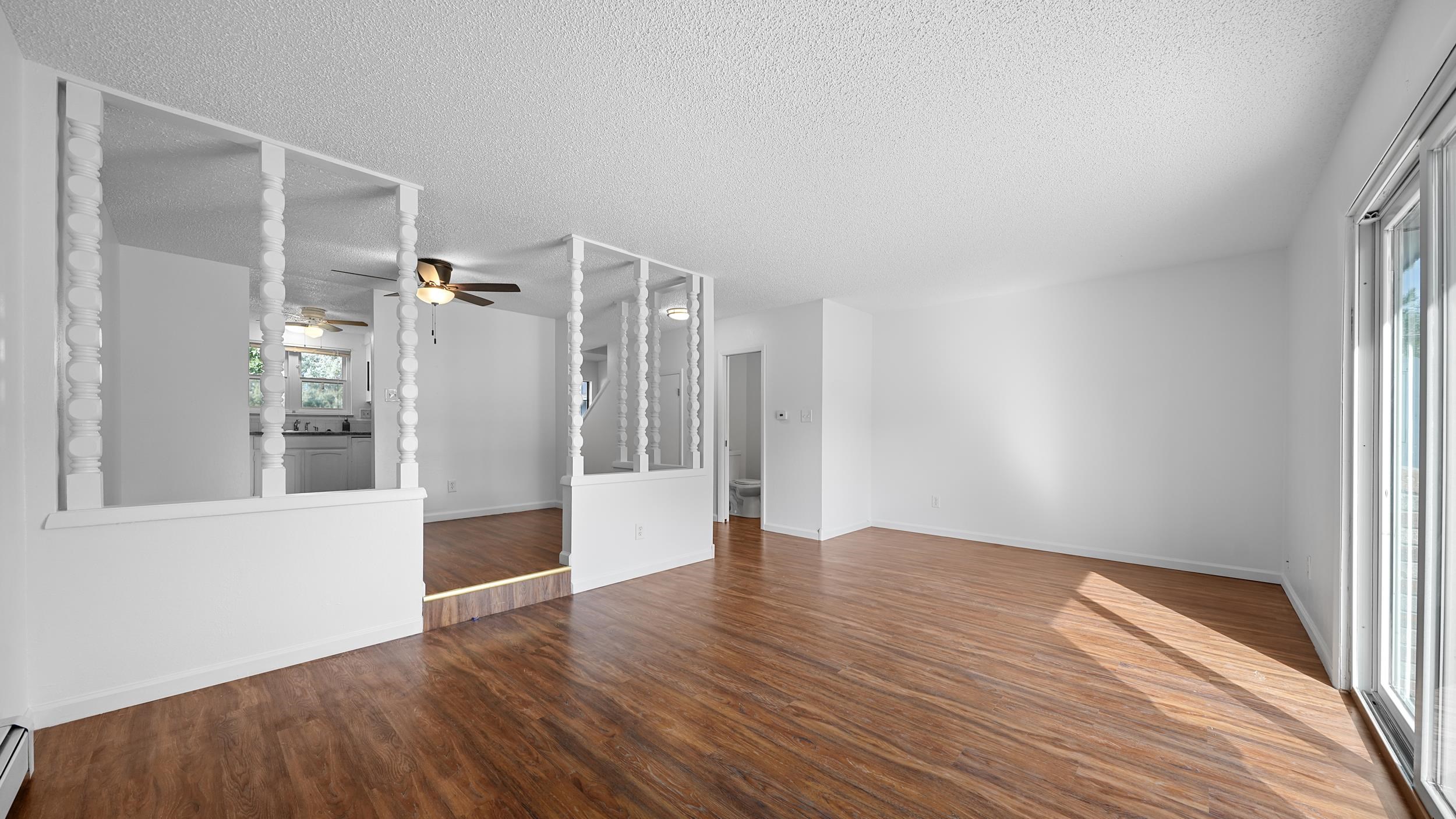 2721 Patterson Road, Unit 903 Grand Junction, CO 81506 - Photo 9 of 22 a view of an empty room with wooden floor and a window