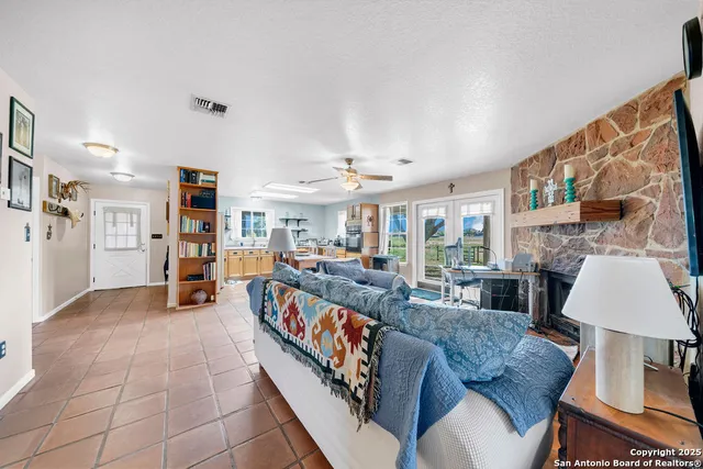 a kitchen with stainless steel appliances granite countertop a sink and cabinets