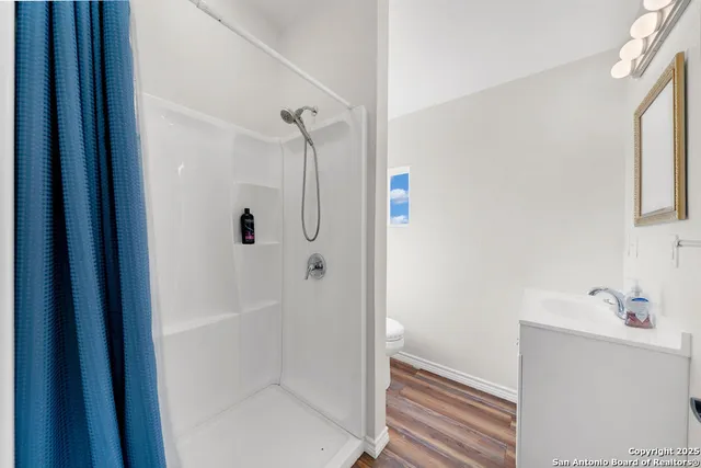 an aerial view of residential house with pool and ocean view