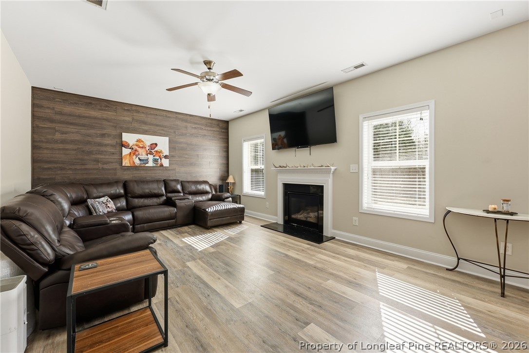 183 Cooper Creek Avenue Spring Lake, NC 28390 - Photo 11 of 34 a living room with furniture fireplace and a flat screen tv