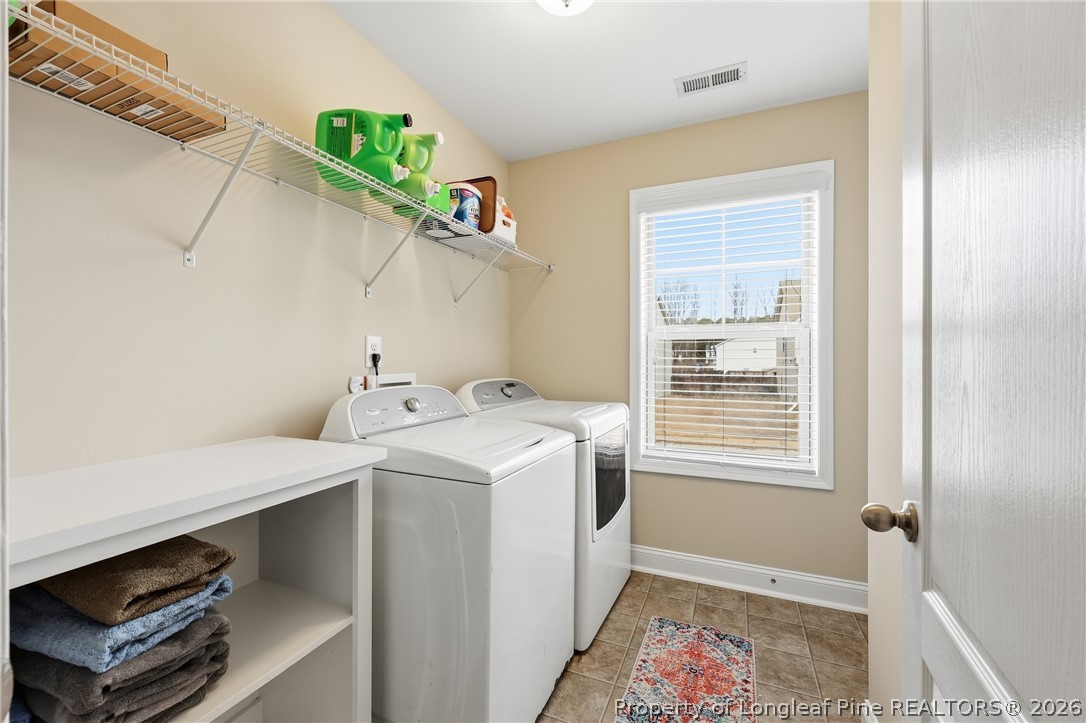 183 Cooper Creek Avenue Spring Lake, NC 28390 - Photo 16 of 34 a utility room with dryer and washer
