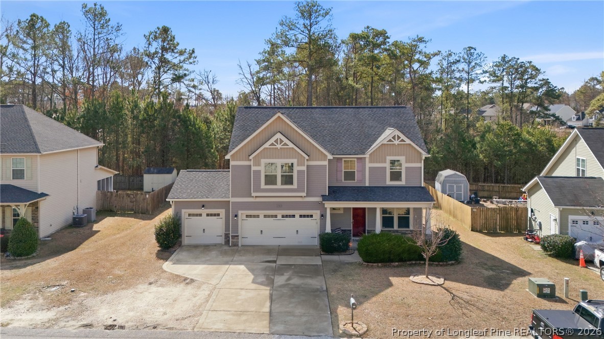 183 Cooper Creek Avenue Spring Lake, NC 28390 - Photo 2 of 34 a front view of a house with a yard and garage
