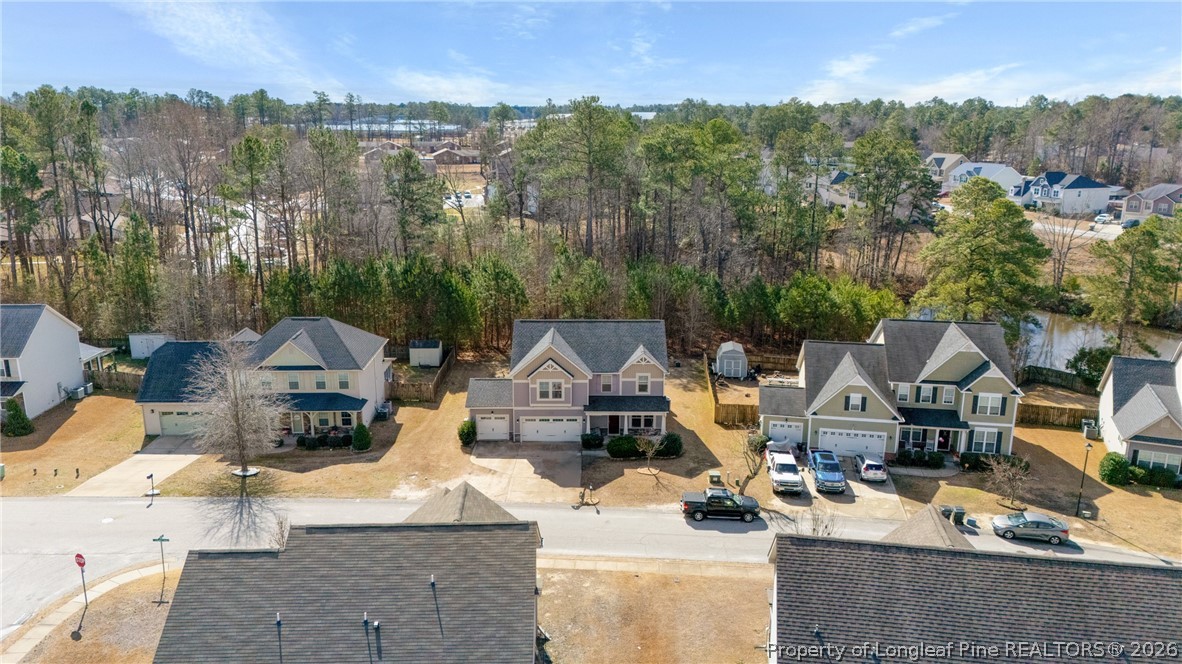 183 Cooper Creek Avenue Spring Lake, NC 28390 - Photo 32 of 34 an aerial view of a house with swimming pool and mountain view