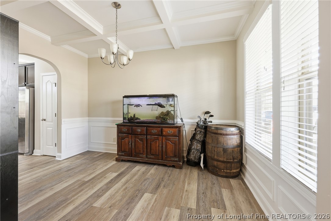 183 Cooper Creek Avenue Spring Lake, NC 28390 - Photo 4 of 34 a room with chandelier fan and wooden floor