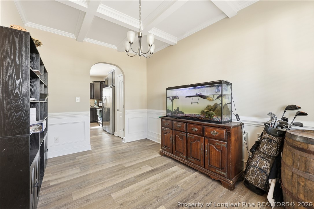 183 Cooper Creek Avenue Spring Lake, NC 28390 - Photo 5 of 34 a living room with stainless steel appliances granite countertop furniture and a chandelier