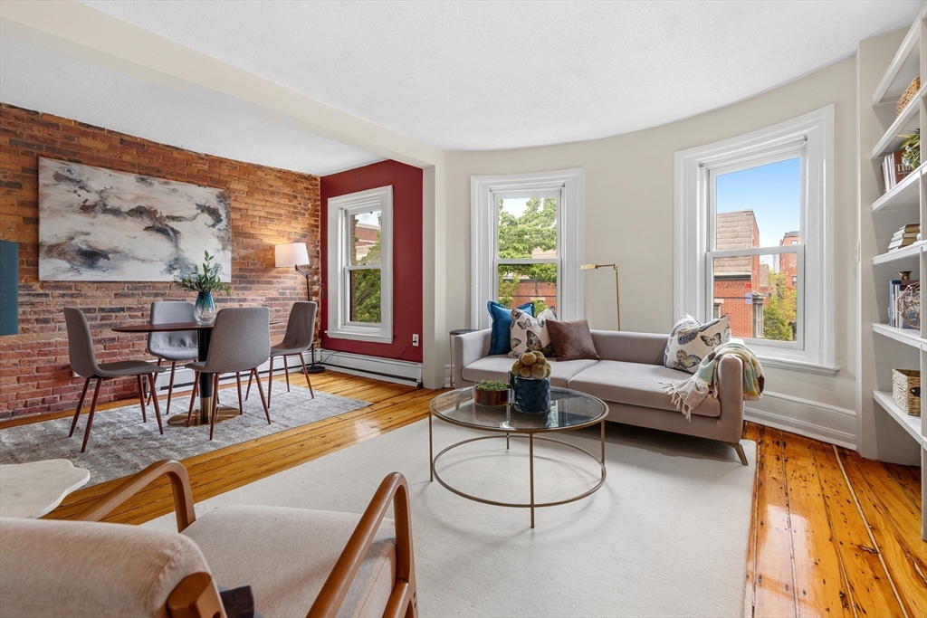 88 West Springfield Street, Unit 3 Boston, MA 02118 - Photo 6 of 17 a living room with furniture and a large window