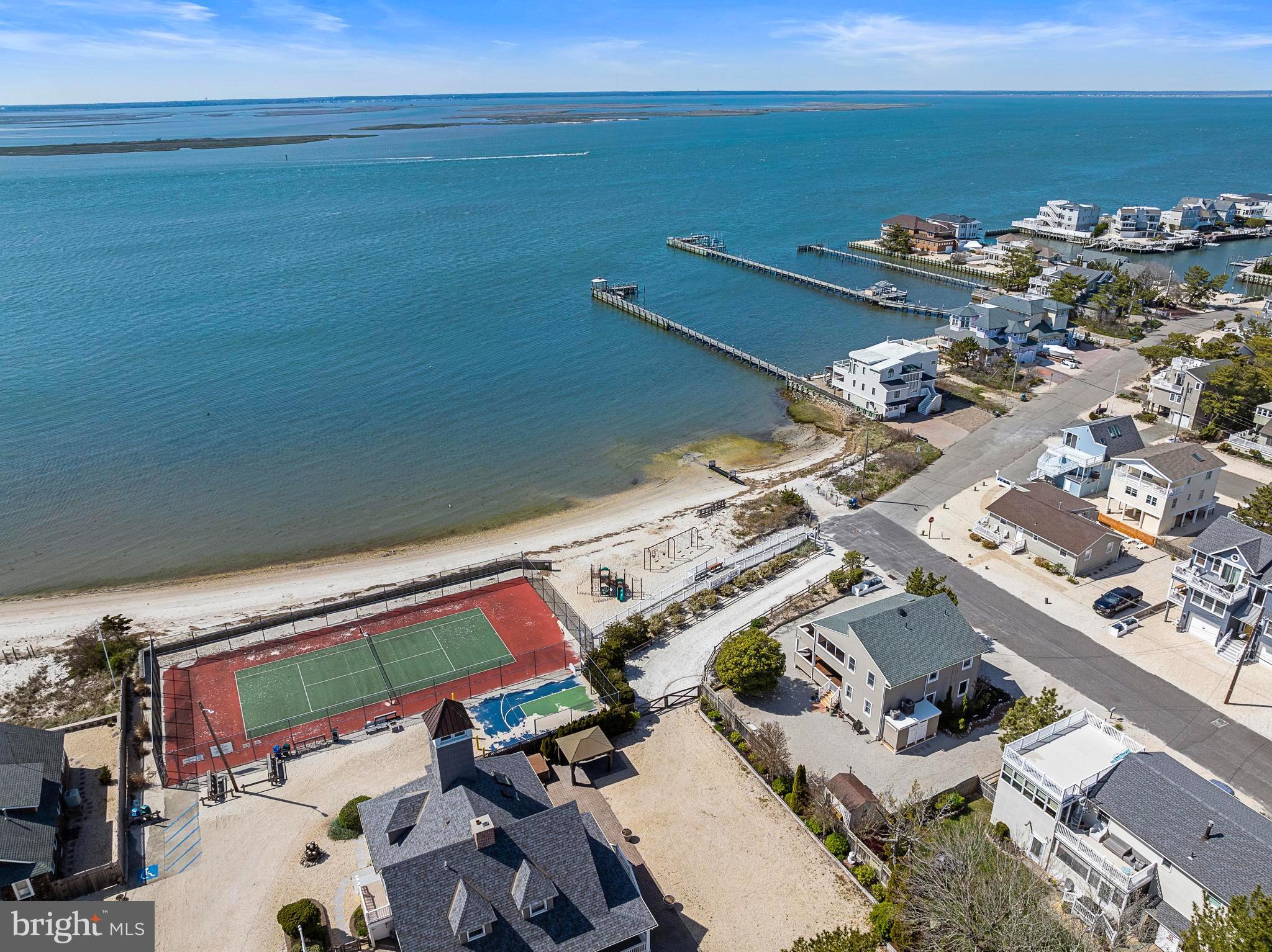 24 Joan Road Long Beach Township, NJ 08008 - Photo 44 of 55 an aerial view of a building with outdoor space