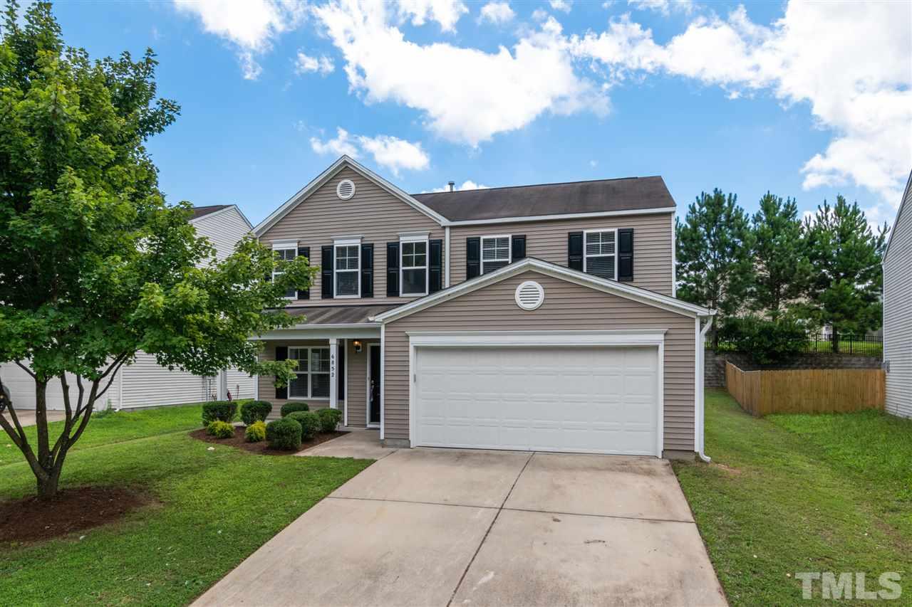 6852 Harter Court Raleigh, NC 27610 - Photo 1 of 29 a front view of a house with a yard