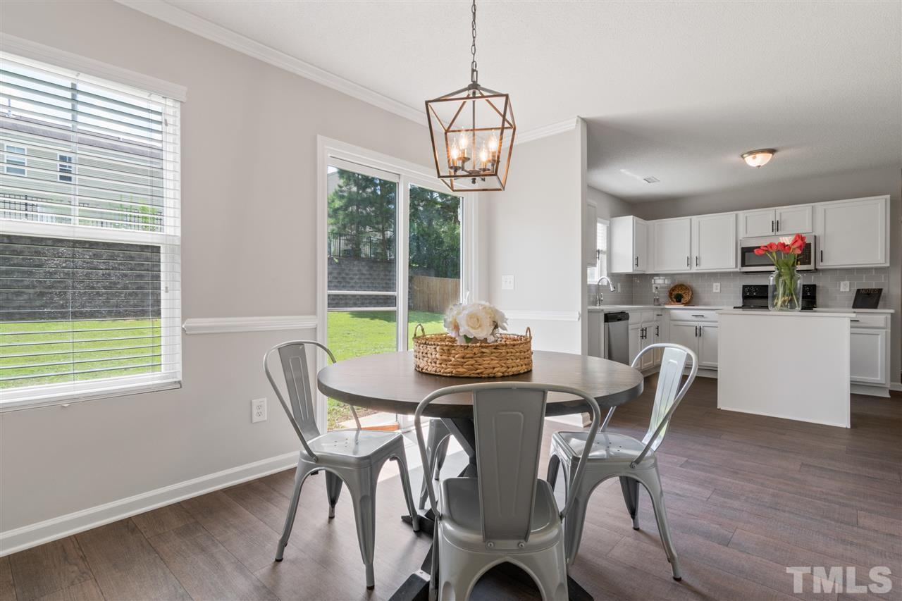 6852 Harter Court Raleigh, NC 27610 - Photo 11 of 29 a view of a dining room with furniture window and outside view