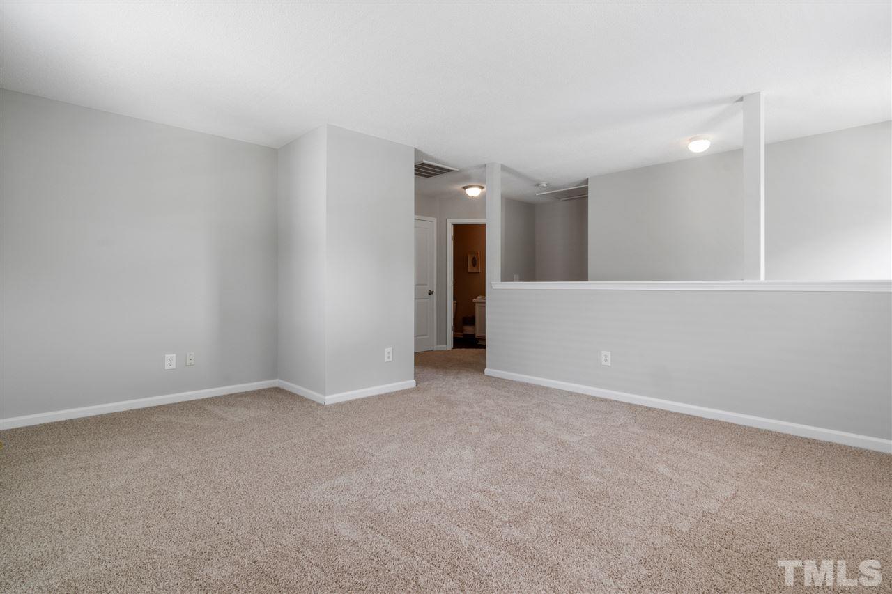 6852 Harter Court Raleigh, NC 27610 - Photo 21 of 29 an empty room with a bathroom