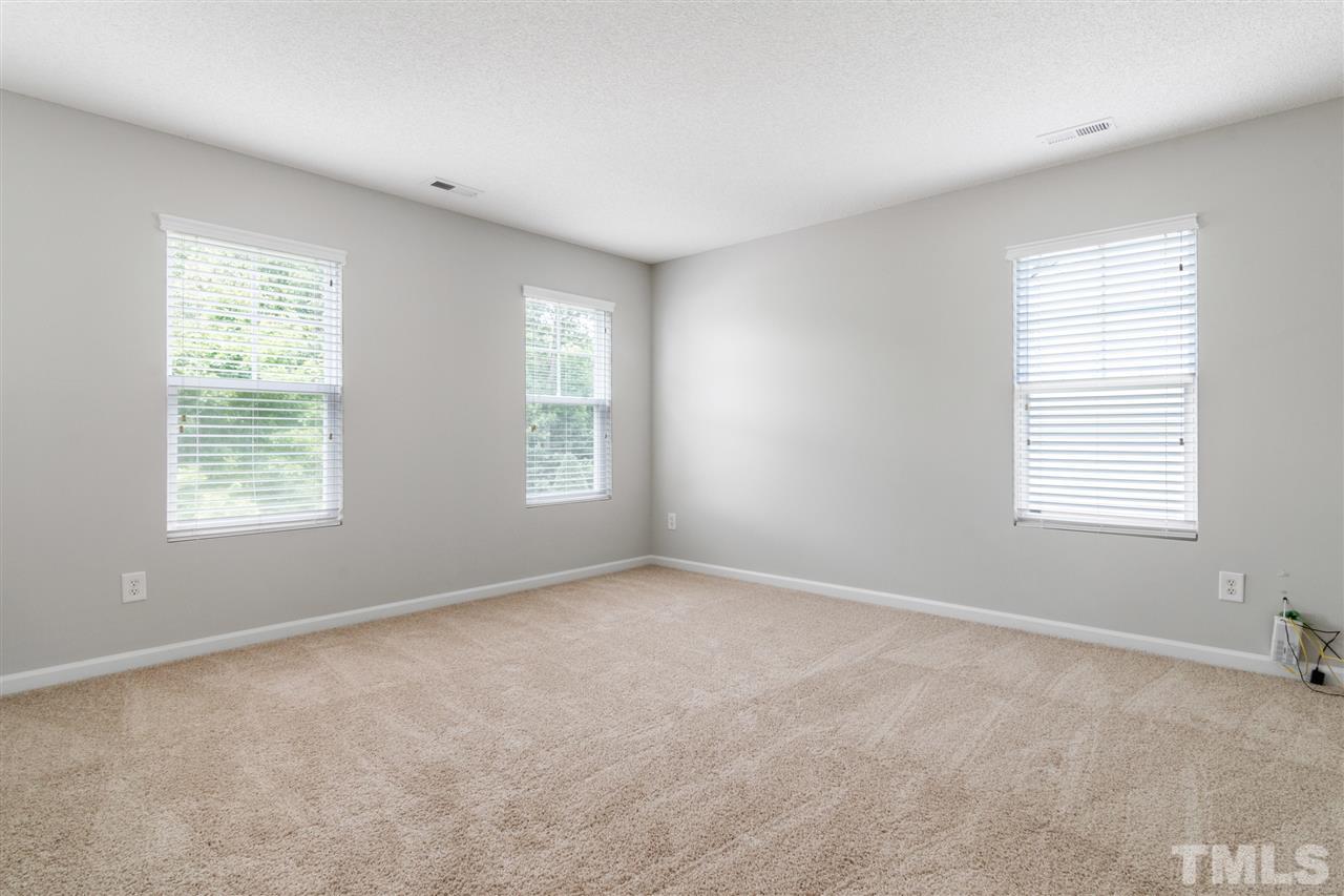 6852 Harter Court Raleigh, NC 27610 - Photo 22 of 29 an empty room with windows