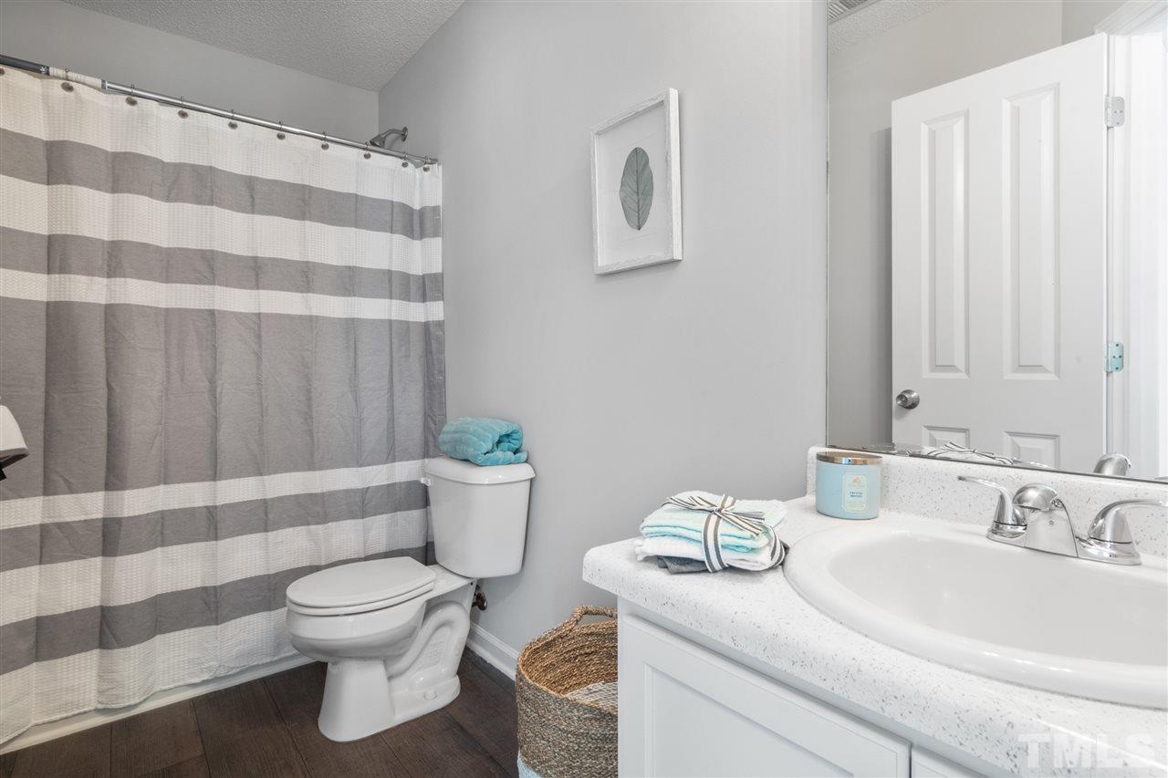 6852 Harter Court Raleigh, NC 27610 - Photo 23 of 29 a bathroom with a sink and a toilet