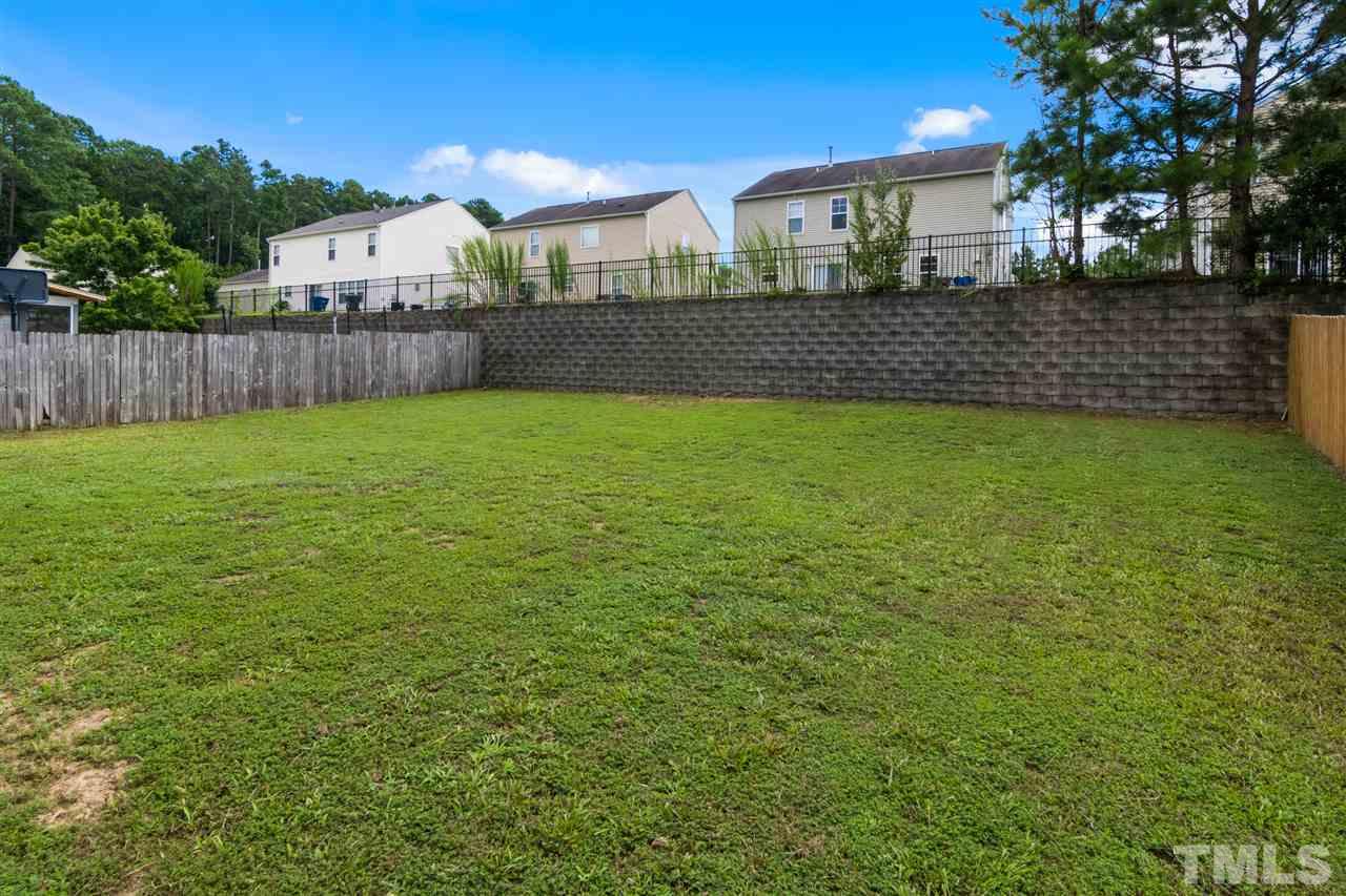 6852 Harter Court Raleigh, NC 27610 - Photo 25 of 29 a view of a house with a yard