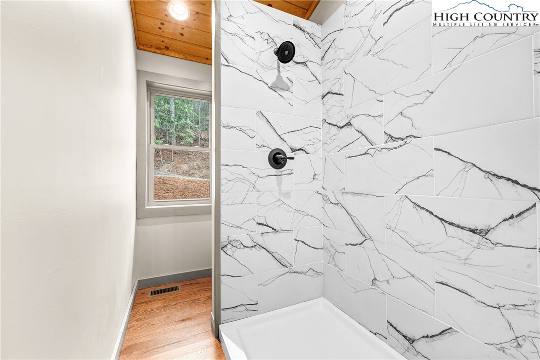 214 Ridge Run Road West Jefferson, NC 28694 - Photo 18 of 49 a bathroom with a shower